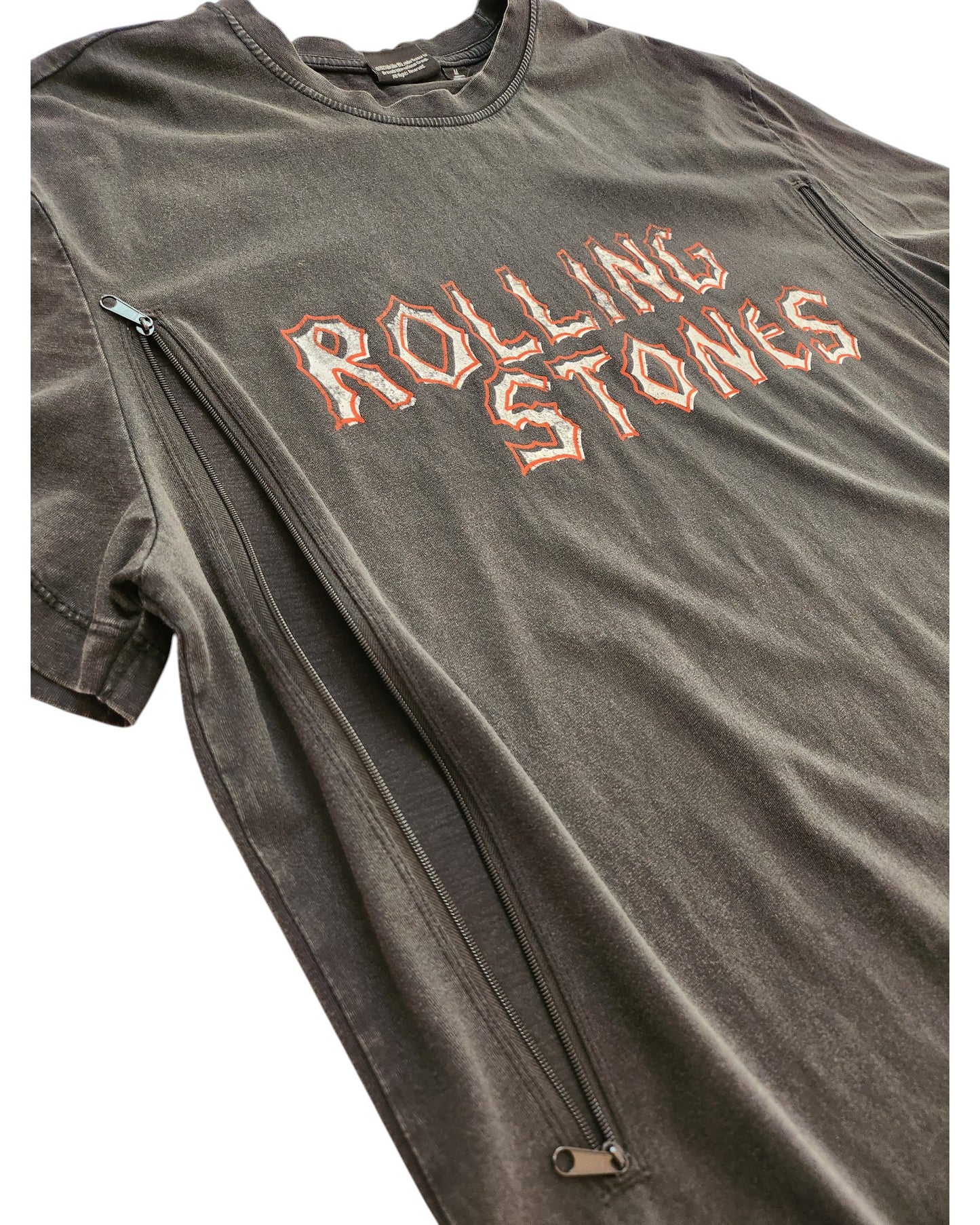 Primark’s Upcycled Breastfeeding & Pumping The Rolling Stones Voodoo T-shirt (M) features bold distressed orange and white lettering, side zippers, and a faded black look—perfect vintage style for nursing or pumping moms.