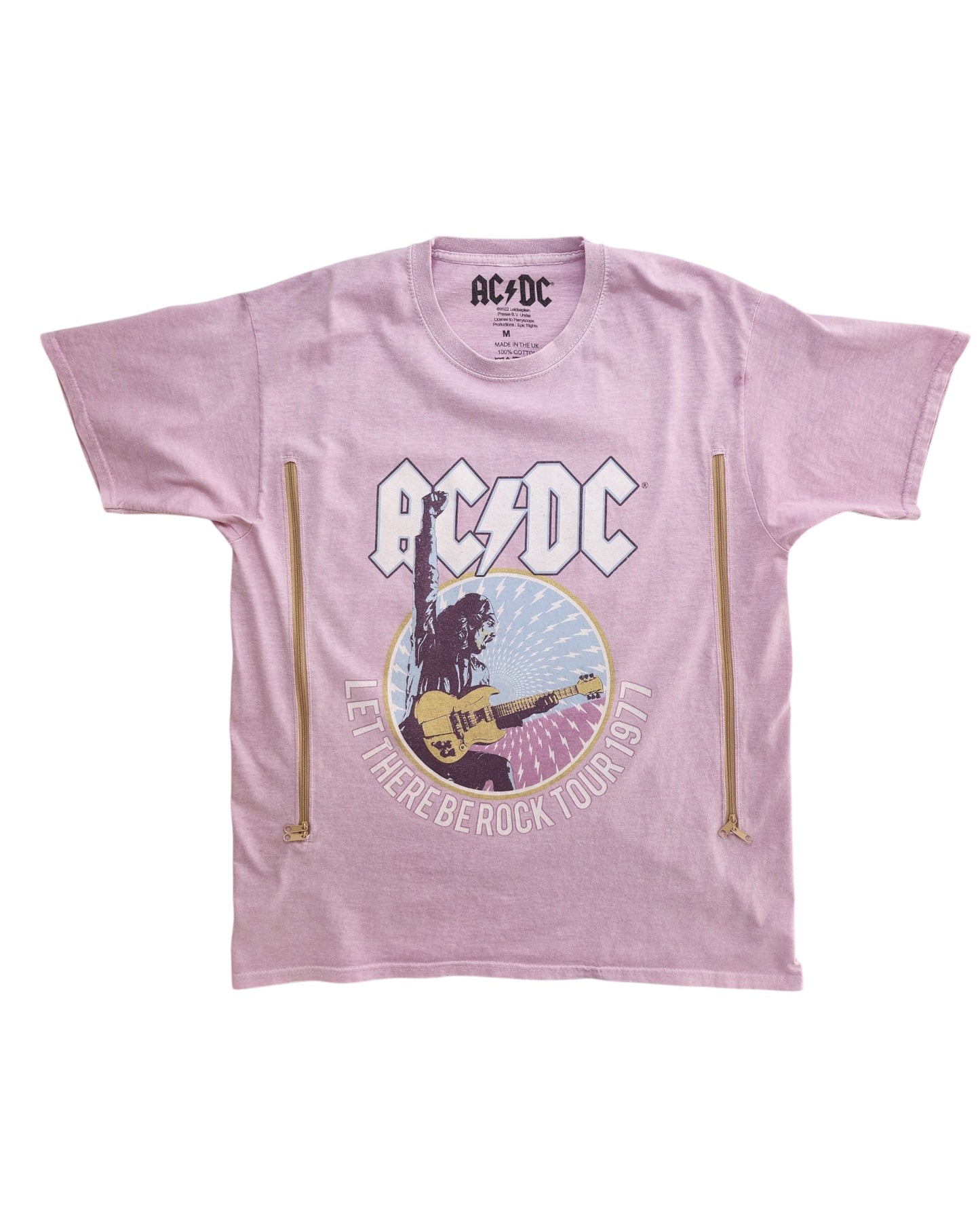 Upcycled lilac AC/DC breastfeeding & pumping t-shirt (M) features a guitarist graphic, band logo, Let There Be Rock Tour 1977 text, and decorative zippers—perfect for fans of preloved fashion and nursing moms.
