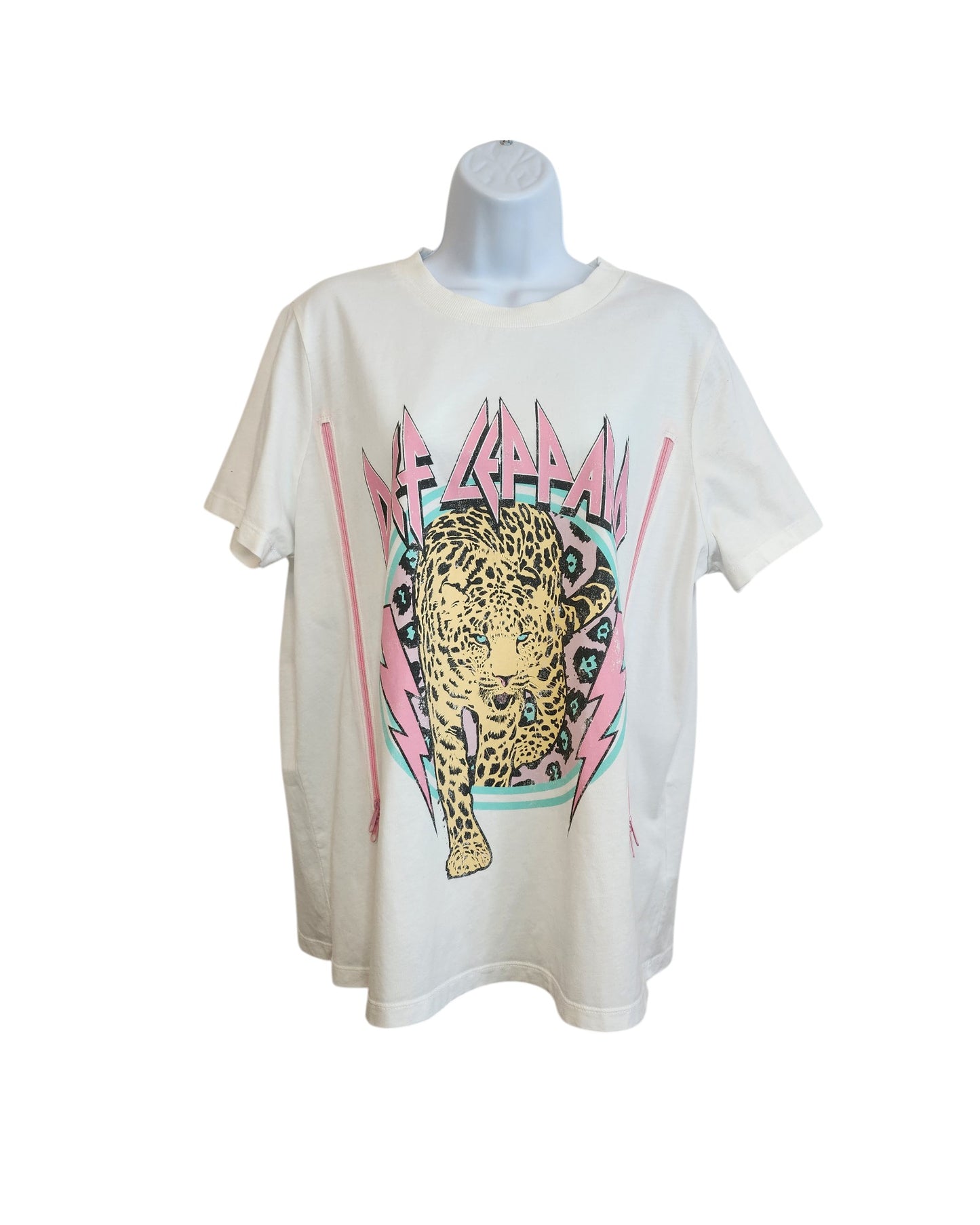 Upcycled Def Leppard Nursing & Pumping T-shirt (Large) in white/pink with a colorful leopard graphic and bold logo. Preloved, perfect for fans seeking unique style and breastfeeding-friendly fashion. Displayed on mannequin against white background.