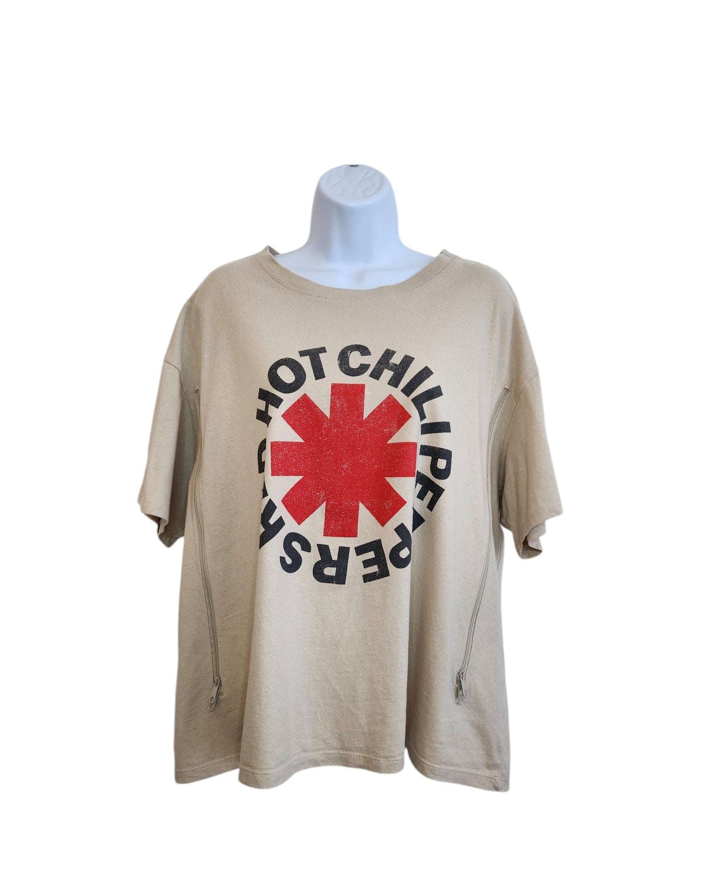 The H&M Upcycled Breastfeeding & Pumping Red Hot Chilli Peppers t-shirt in XL is beige, made from eco-friendly materials, with a bold red asterisk and black band name, shown on a white mannequin against a plain background.
