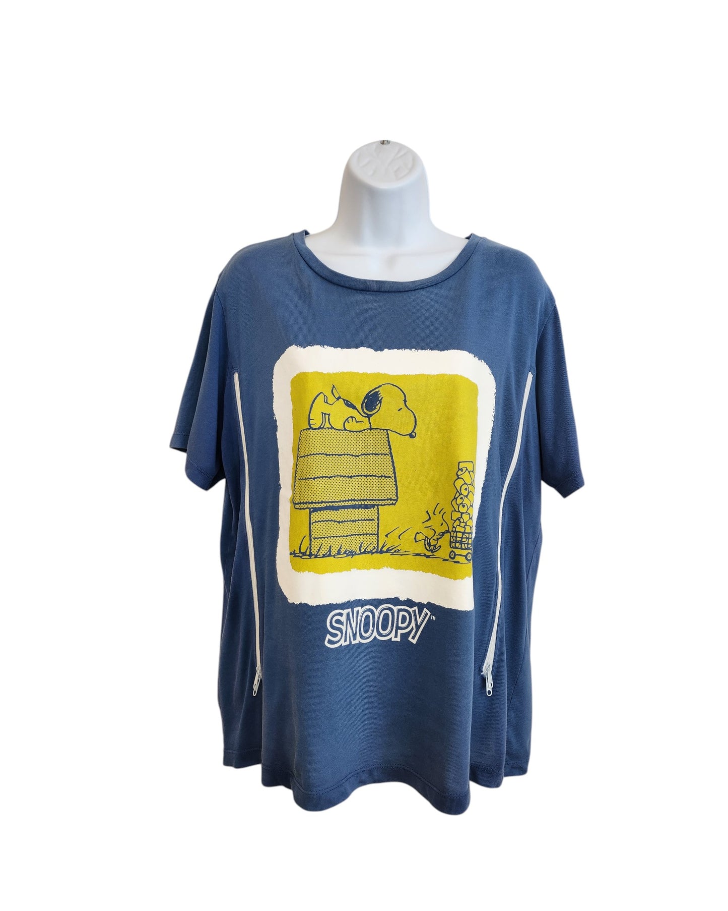 The ZARA Upcycled Breastfeeding & Pumping Snoopy Blue t-shirt (M) features a yellow and white graphic of Snoopy on his doghouse with Woodstock and SNOOPY below. Made from upcycled clothing, shown on a white mannequin torso.