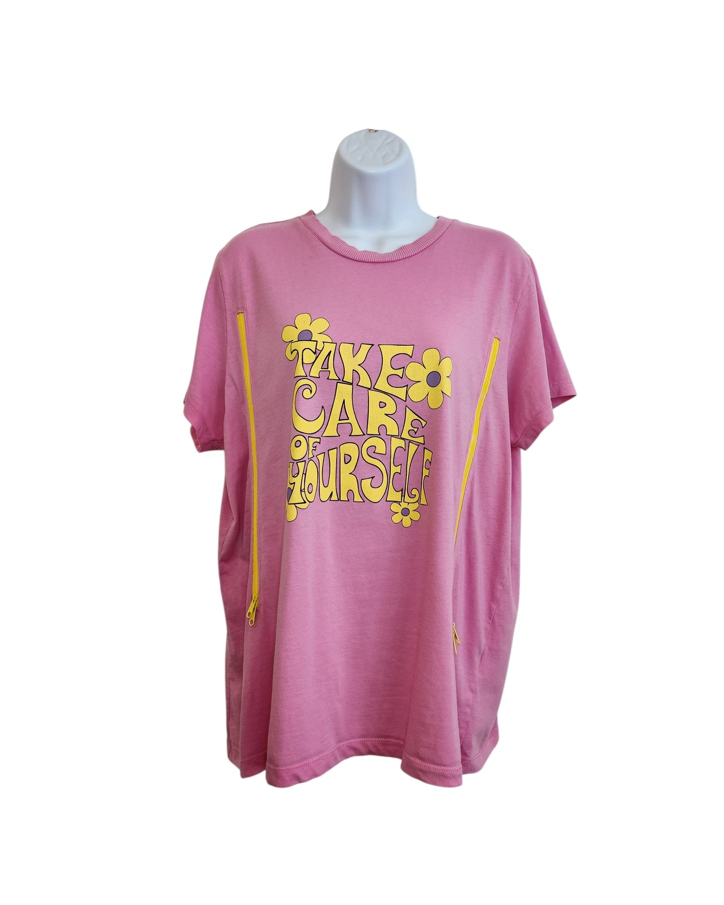 The Primark Upcycled Breastfeeding & Pumping Pink Take Care t-shirt (L, UK14/16) features Take Care of Yourself in bold yellow with floral designs, made from eco-friendly materials for a mindful touch.