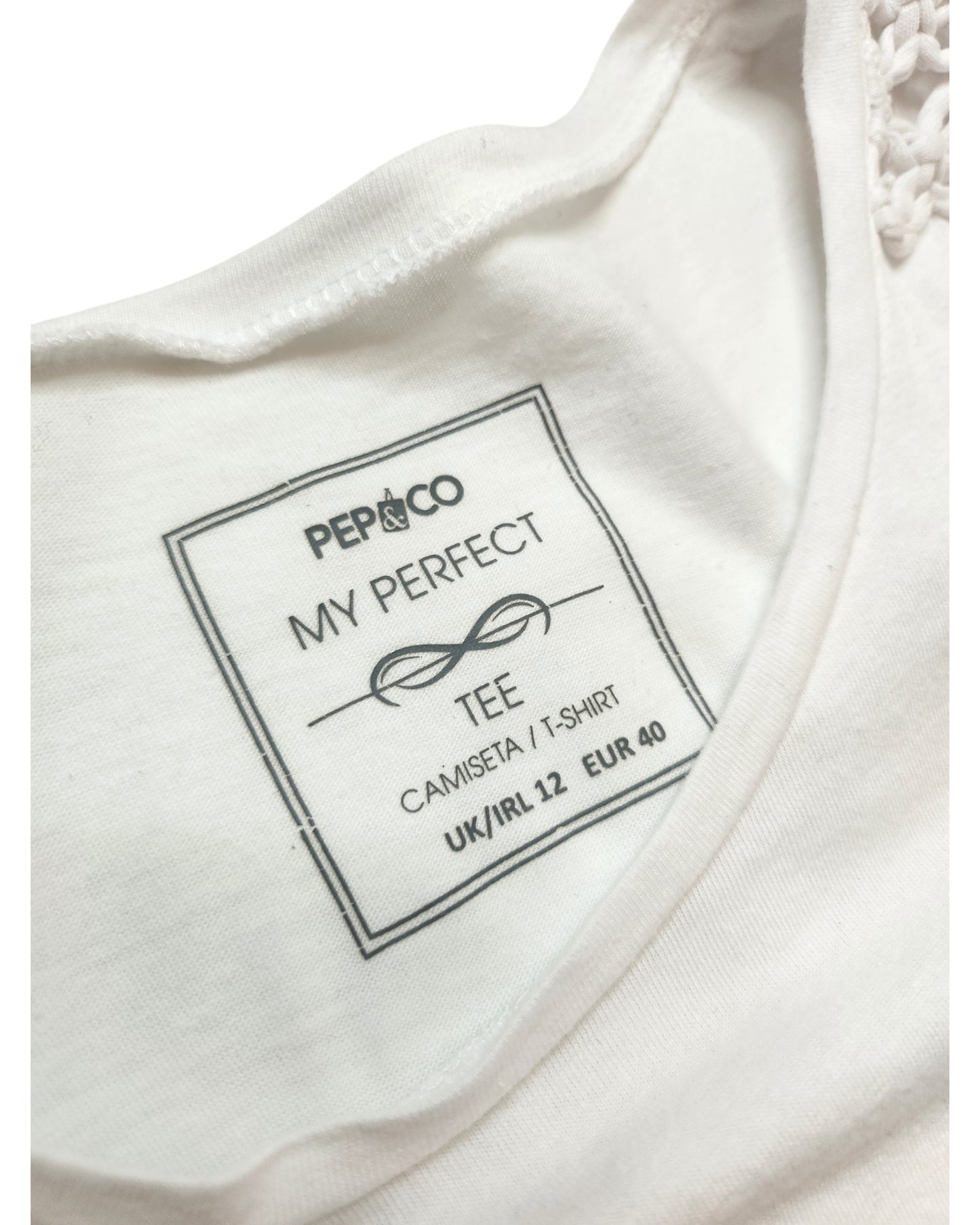 Close-up of a Pep & Co Upcycled Breastfeeding & Pumping Plain White Shoulder Fringing t-shirt (UK12); label inside collar reads MY PERFECT TEE with size UK/IRL 12, EUR 40, printed in black ink.