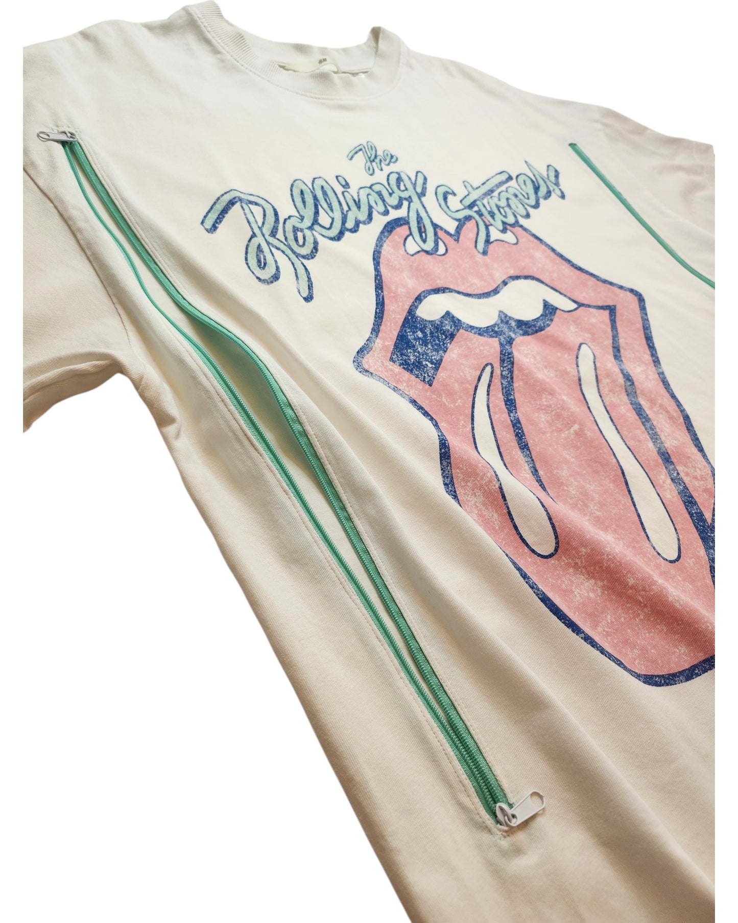 Upcycled H&M Rolling Stones white/blue T-shirt (L) for breastfeeding & pumping, featuring a faded logo, blue band name text, and two vertical green zippers on each side—rock n roll flair with nursing-friendly function.
