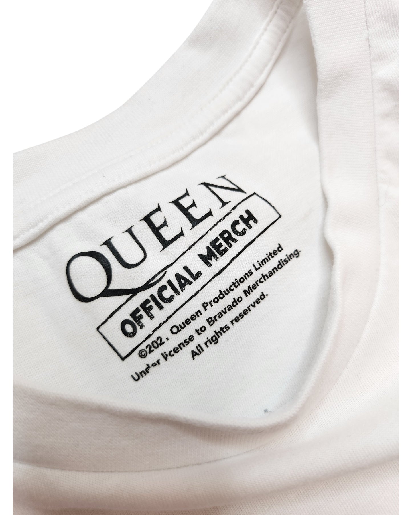 Close-up of the collar on the Upcycled Breastfeeding & Pumping White Queen t-shirt UK16 by Queen, featuring an official printed label—perfect for preloved fashion fans seeking unique band merchandise.