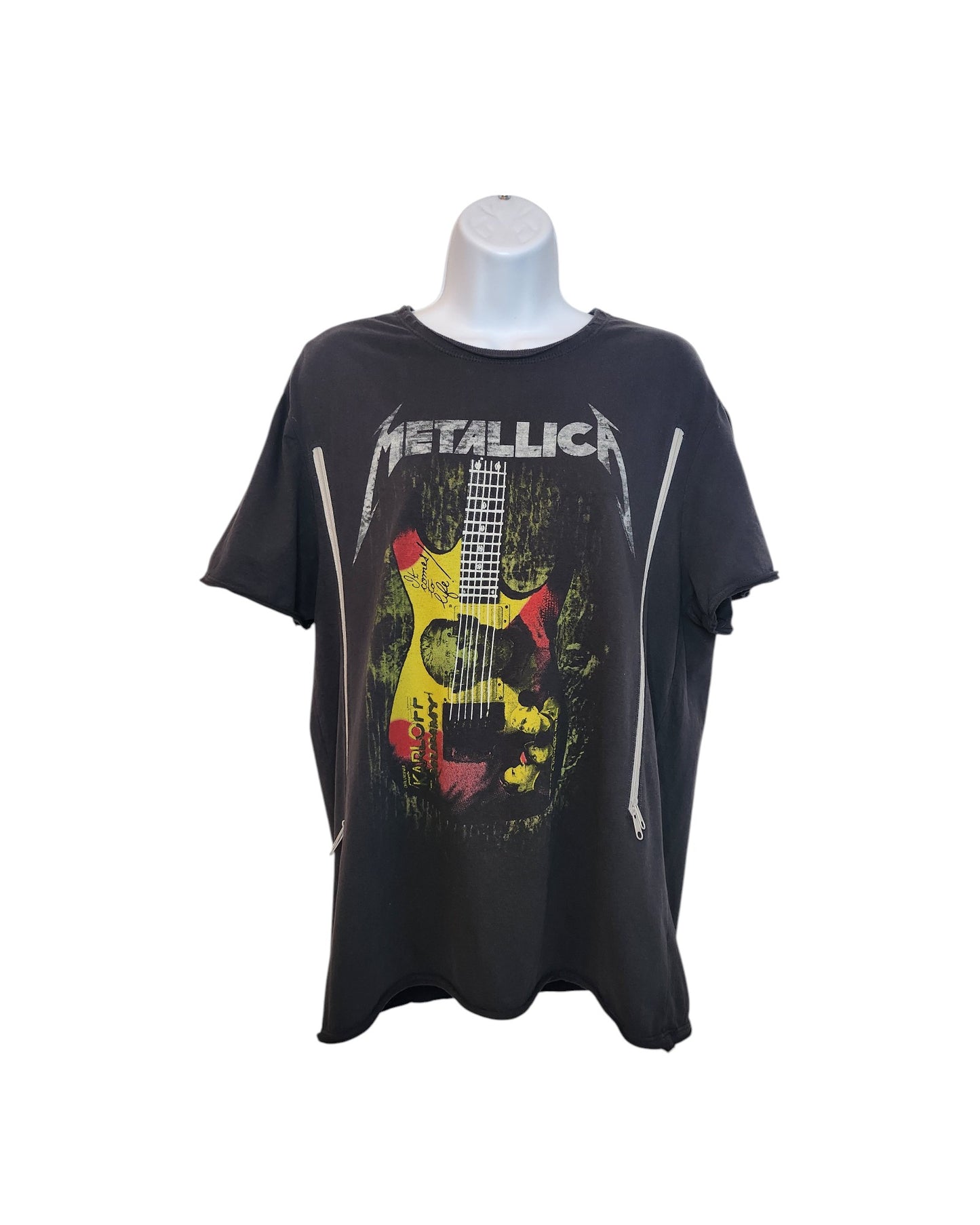 The Amplified Upcycled Breastfeeding & Pumping Metallica Guitar Band t-shirt (M) features a black short-sleeve design, the Metallica logo, red/yellow/white guitar graphic, and two vertical front zippers. Shown on a mannequin torso.