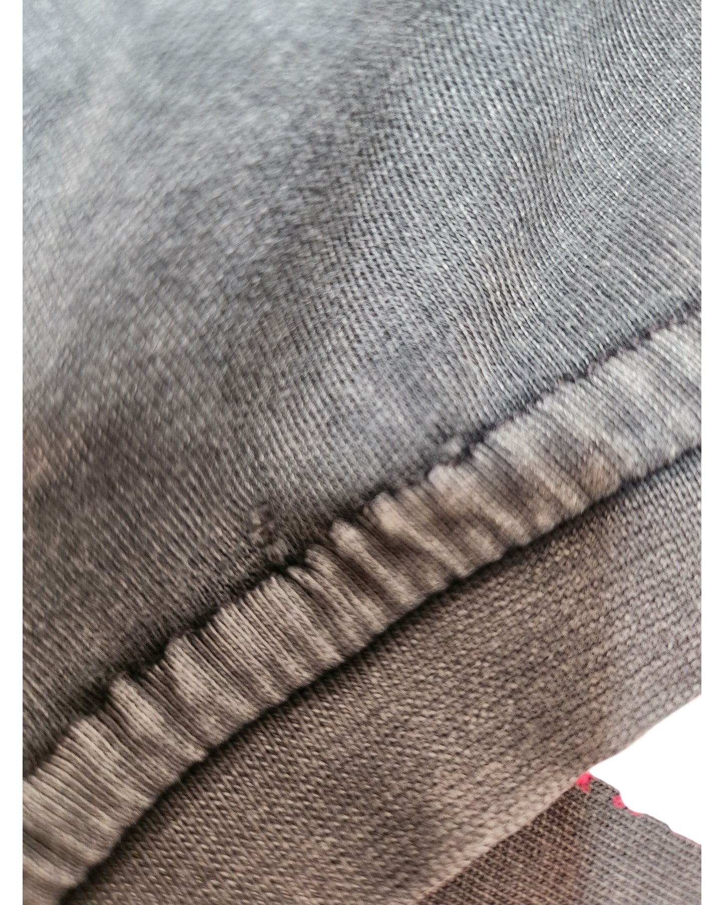 Close-up of a Primark Upcycled Breastfeeding & Pumping Nirvana Band tee (XS, UK6/8) in dark grey/red floral, highlighting visible stitching and texture—ideal for appreciating the quality of sustainable fashion.