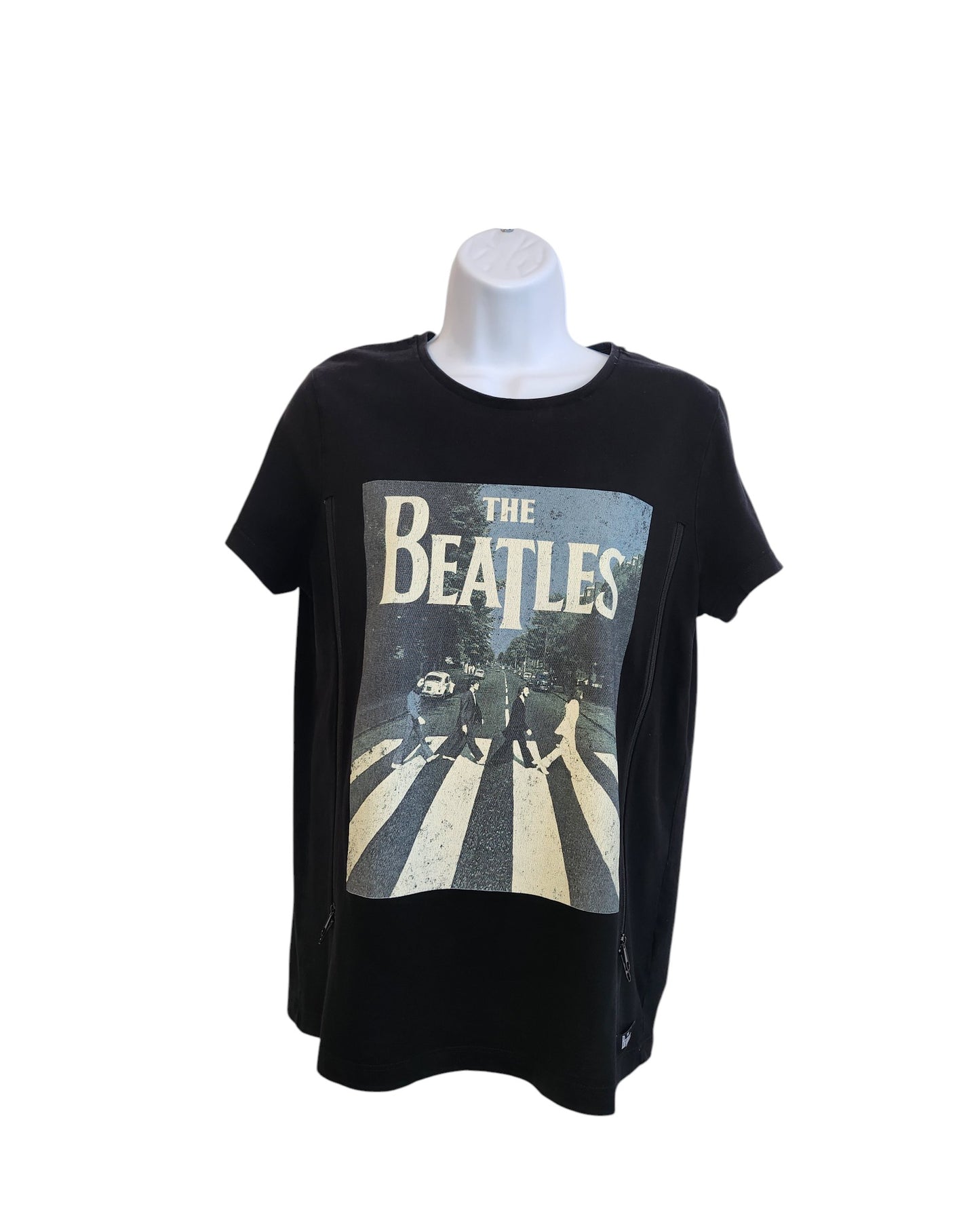 The Summer of Rock Upcycled Breastfeeding & Pumping The Beatles t-shirt (UK10) features the iconic Abbey Road cover, combining eco-friendly fashion with nursing functionality. Displayed on a white mannequin torso.