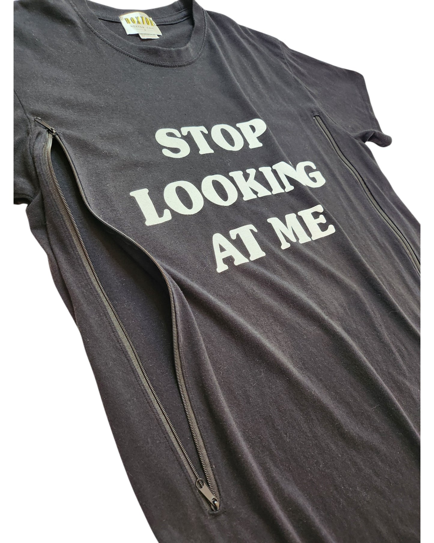 The Hoxton Chic Upcycled Breastfeeding & Pumping Stop Looking t-shirt M is a black, eco-friendly tee with white STOP LOOKING text and vertical zippers for easy nursing or pumping.