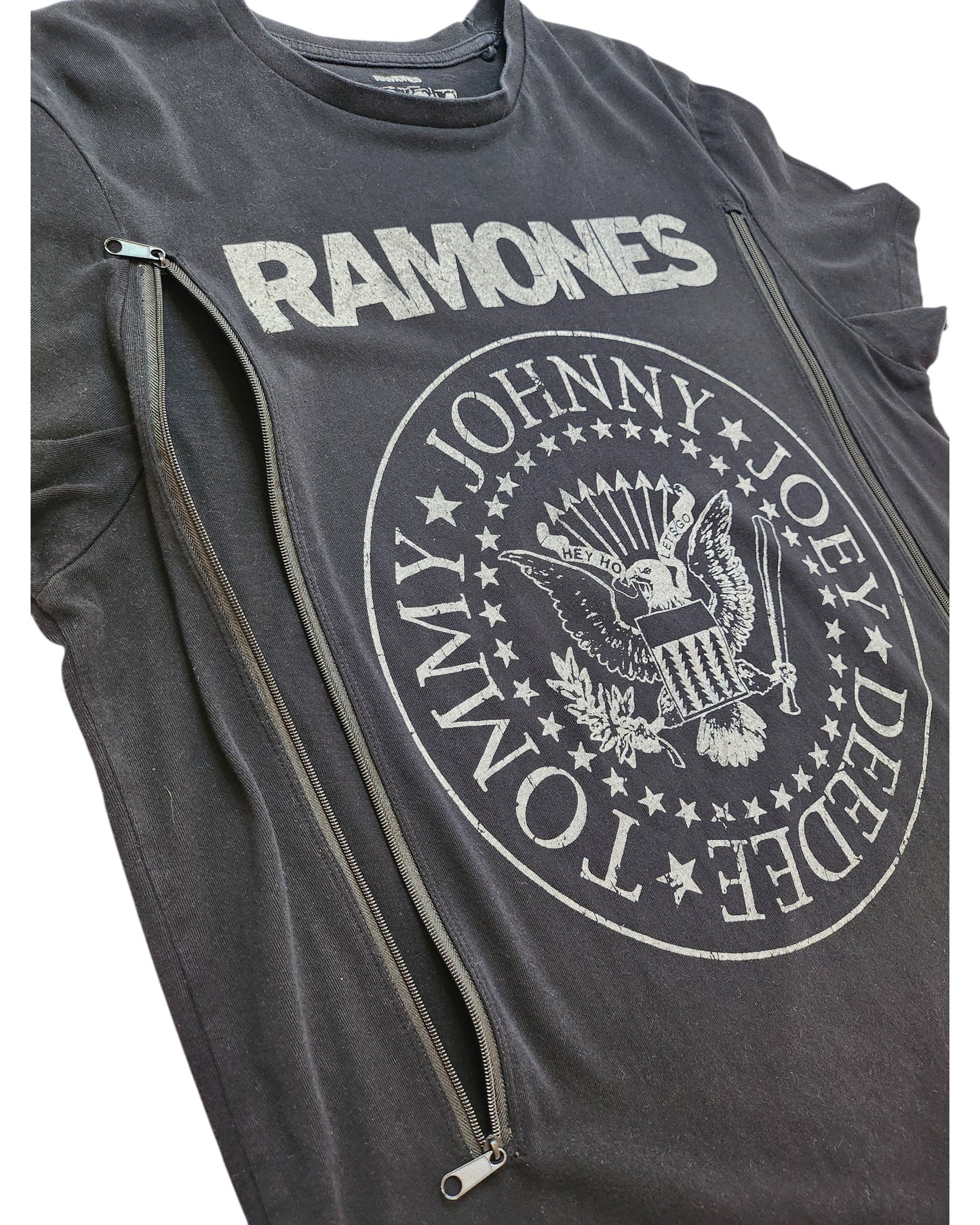 Primark Upcycled Ramones Band t-shirt (L): black tee with logo and member names, two diagonal zippers for easy breastfeeding or pumping—an edgy, sustainable choice for fans seeking unique nursing style.