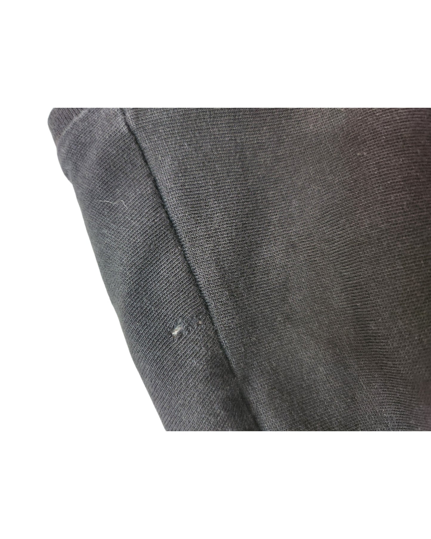 Close-up of a black Upcycled Breastfeeding & Pumping Ramones Band t-shirt (L) by Primark, featuring a small hole near the seam—ideal eco-friendly apparel with minor wear.