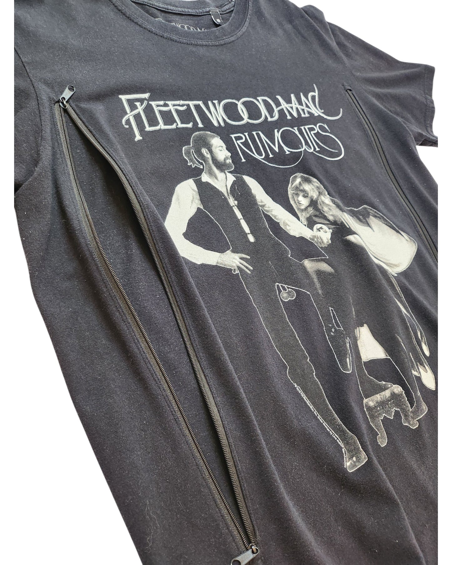 The Upcycled Fleetwood Mac Rumours Black T-shirt (UK10) features album artwork with two band members in black and white beneath the band name, plus side vertical zippers for easy breastfeeding or pumping. Perfect for stylish, practical nursing wear.