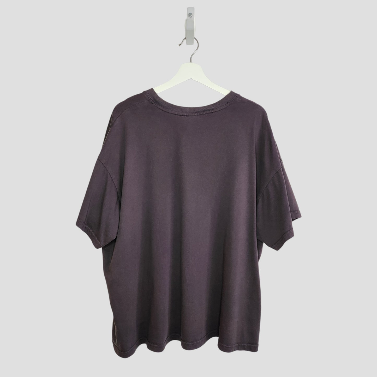 An upcycled H&M Breastfeeding & Pumping Grey Star Wars T-shirt (XL) hangs on a white hanger, shown from the back against a light gray background.