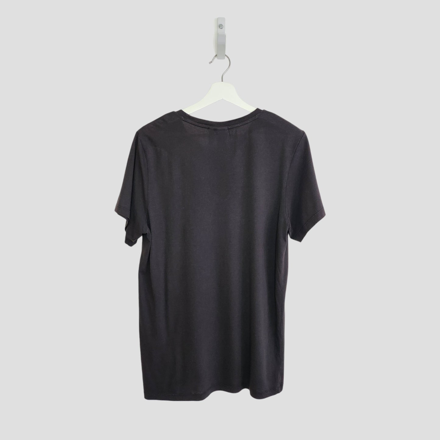 An upcycled Adidas breastfeeding and pumping black/white t-shirt (UK14) is displayed on a white hanger against a light gray background, shown from the back.