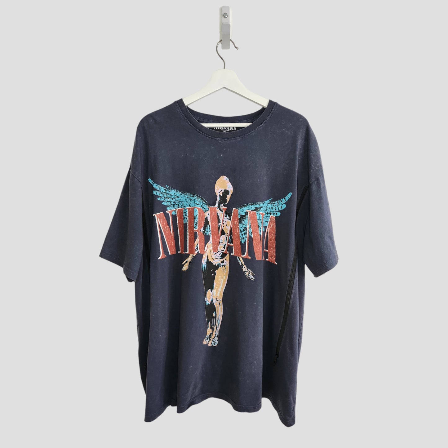 An upcycled Primark Nirvana Angel Band t-shirt in grey/turquoise (XL, UK18/20), perfect for breastfeeding and pumping—unique preloved clothing for your collection.
