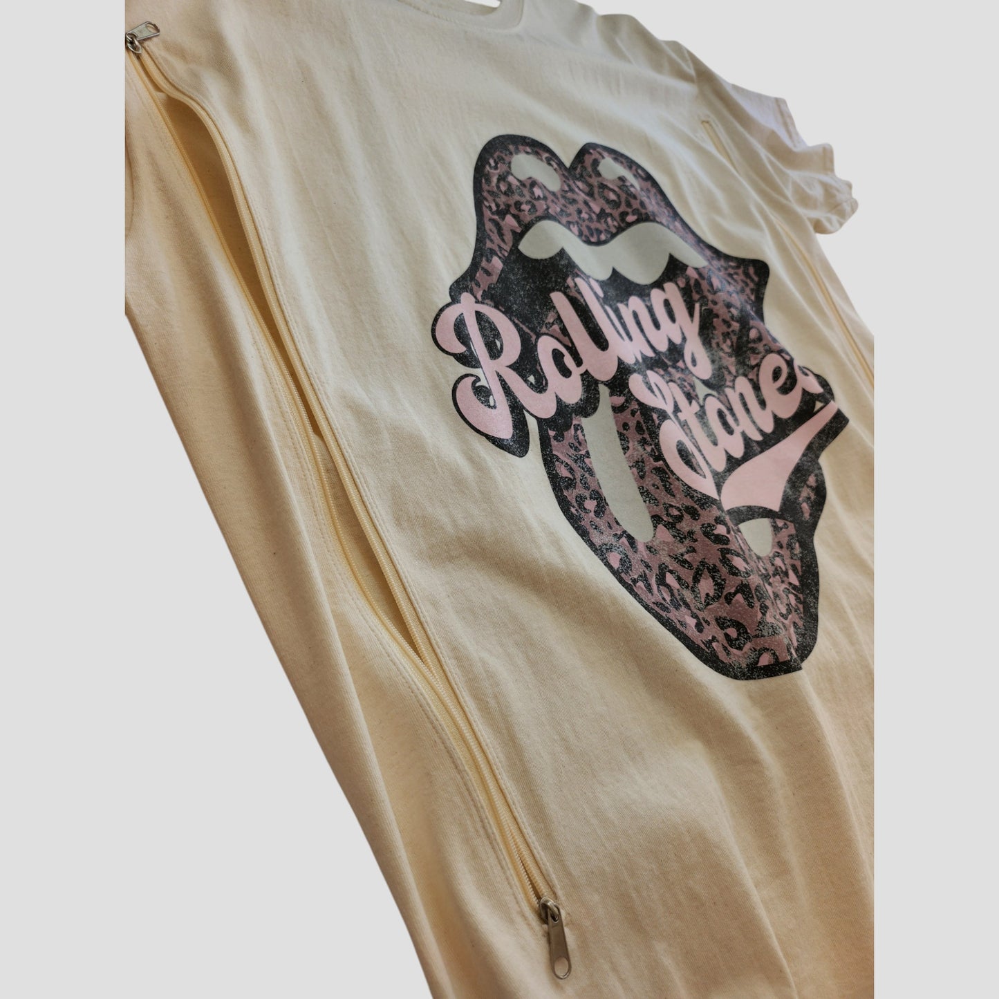 The Rolling Stones Upcycled Breastfeeding & Pumping Cream/Pink Band T-shirt (XL, 100272) combines eco-friendly nursing access with iconic lips logo—perfect for stylish, rock-inspired moms.
