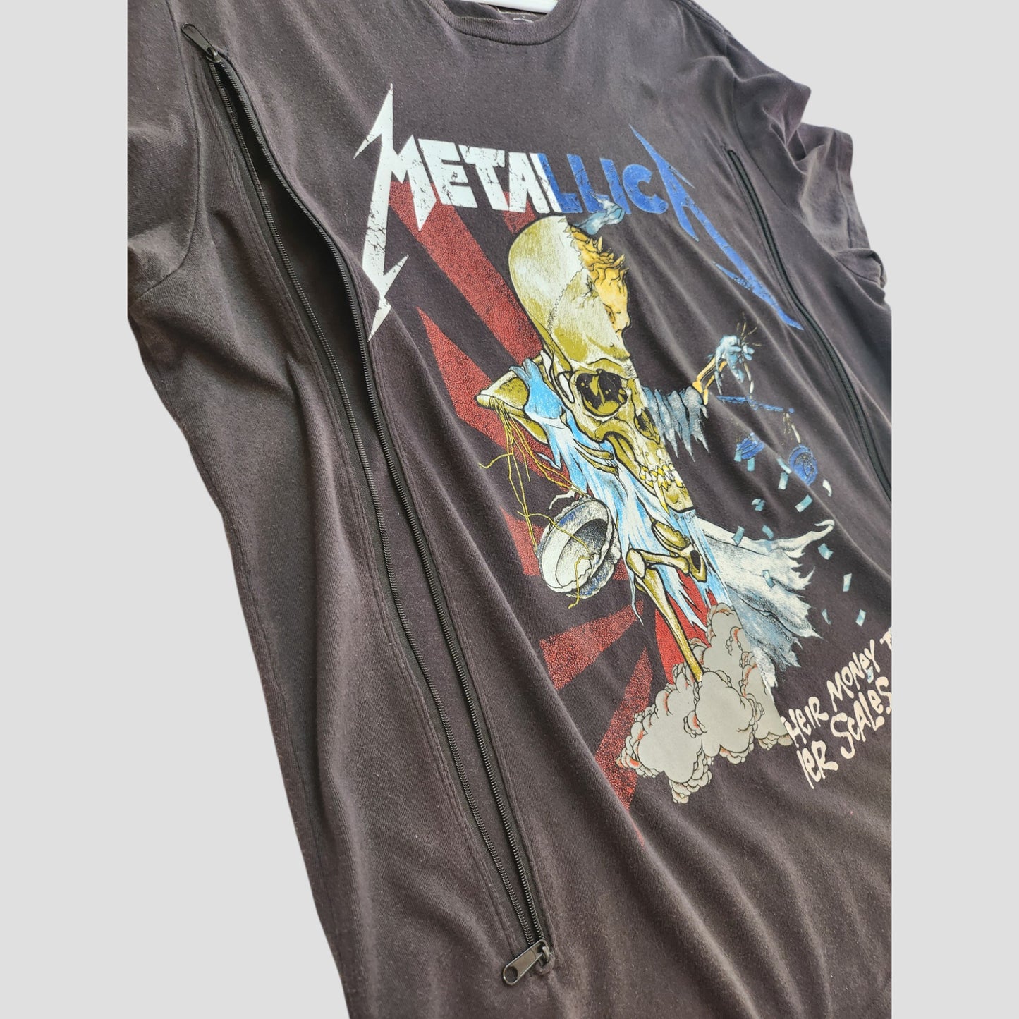The upcycled GAP Breastfeeding & Pumping Metallica t-shirt (L, 100085) features vibrant skeleton artwork and “Metallica” text—perfect for fans seeking stylish, comfortable nursing wear with edgy flair.