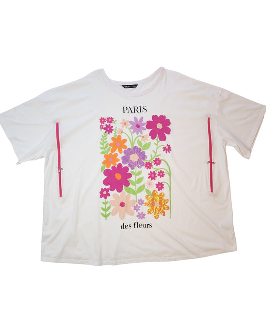 The Upcycled Breastfeeding (Nursing) & Pumping Paris Floral T-shirt UK26/28 by touched out mama is an eco-friendly white shirt with PARIS des fleurs text, a vibrant floral design in pink, purple, and orange, and side pink zippers for convenient breastfeeding access.
