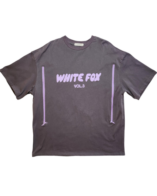 This preloved piece from touched out mama is the Upcycled Breastfeeding (Nursing) & Pumping White Fox T-shirt L featuring the words WHITE FOX VOL.3 in white on dark gray, plus two vertical lavender accents flanking the text for a stylish touch.