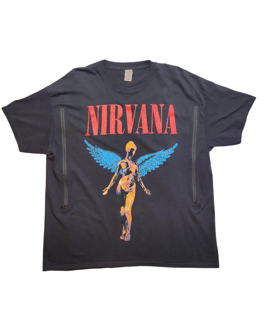 This preloved Upcycled Breastfeeding (Nursing) & Pumping Nirvana T-shirt XL by touched out mama features a vibrant angelic figure with blue wings and anatomical design, highlighted by the word Nirvana in bold red letters, adding a unique charm to this sustainable piece.