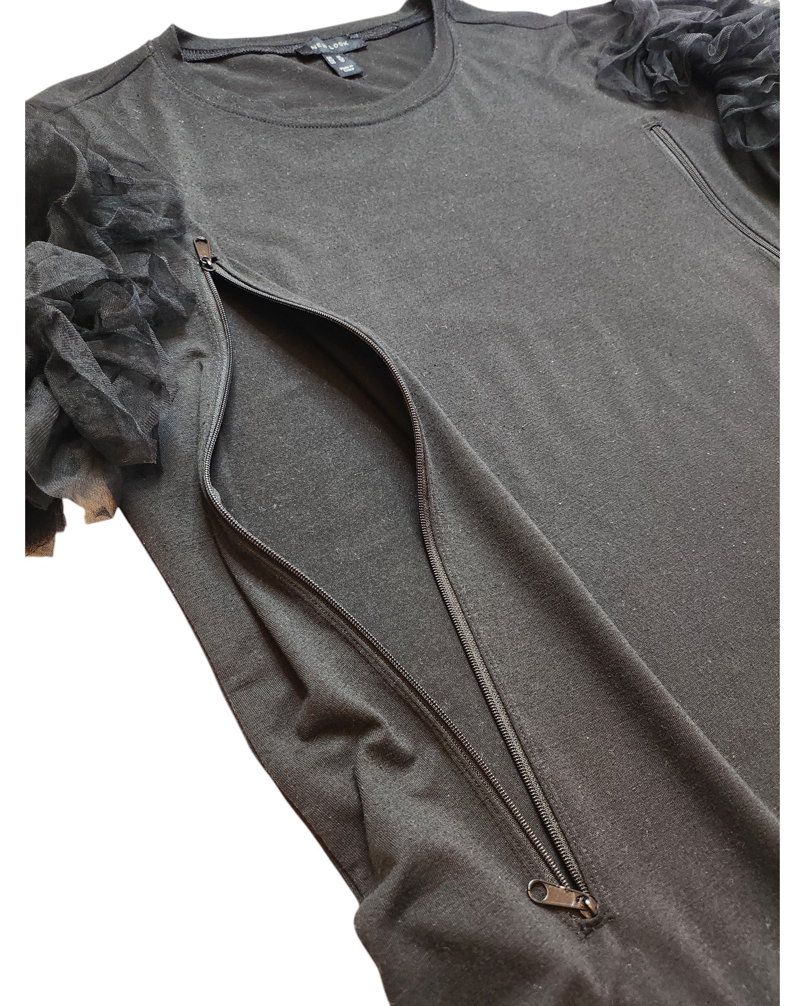 The touched out mama Upcycled Breastfeeding & Pumping Black Tulle t-shirt (UK14) combines elegance with functionality, featuring tulle ruffle shoulder details and diagonal zips from shoulder to underarm. Its shimmering finish adds glamour for the stylish mom.