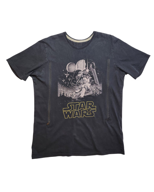 Preloved Star Wars t-shirt by touched out mama, featuring a vintage design with Darth Vader and the Death Star under a starry sky. The classic logo in yellow adds to the timeless appeal of this upcycled breastfeeding & pumping piece.