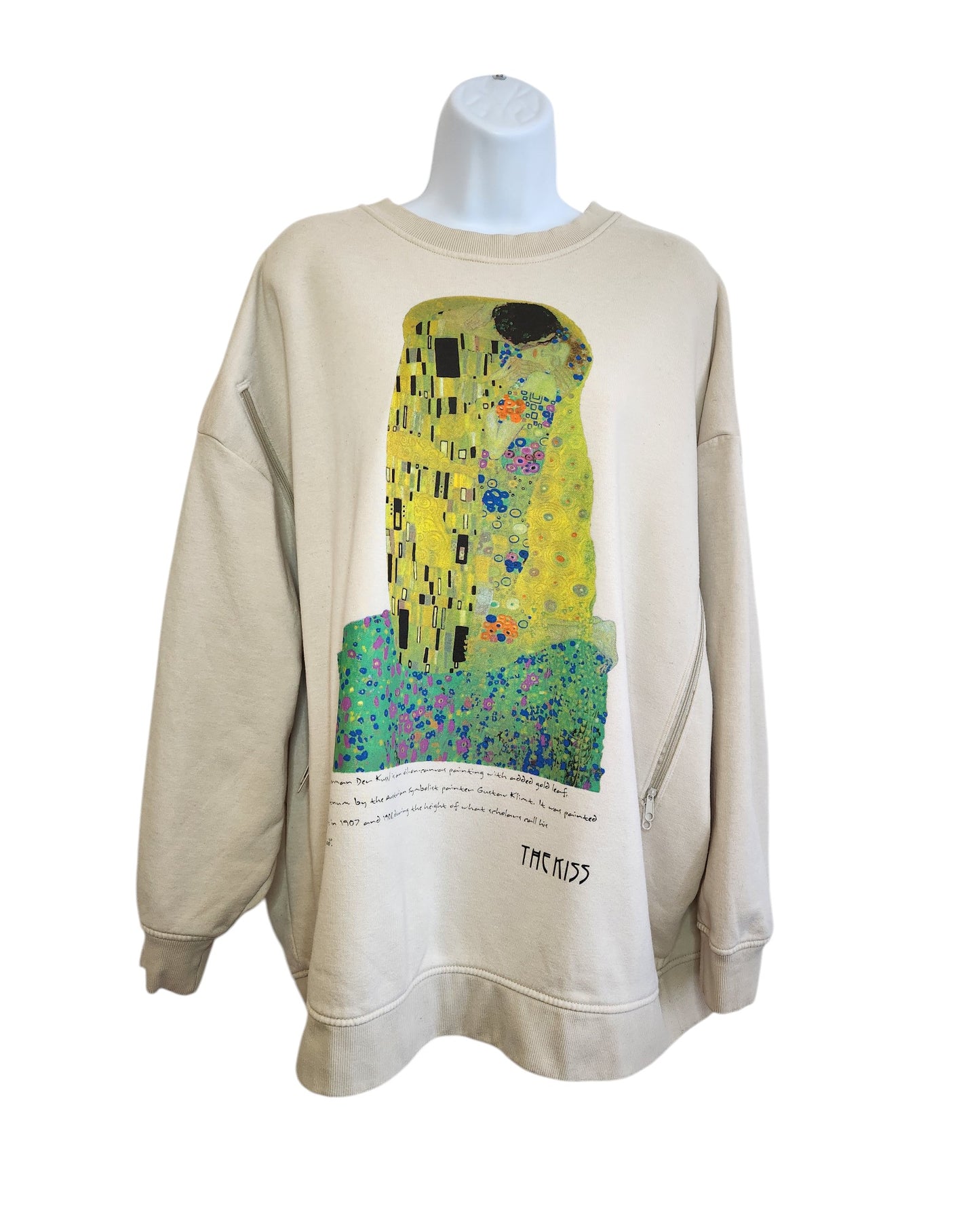 Touched out mamas Upcycled Breastfeeding & Pumping The Kiss Sweatshirt XL features a colorful abstract design inspired by Klimts The Kiss, with geometric shapes and an embracing couple. This beige long-sleeve sweatshirt offers a relaxed fit, a round neckline, and includes a small text and artist signature at the bottom.