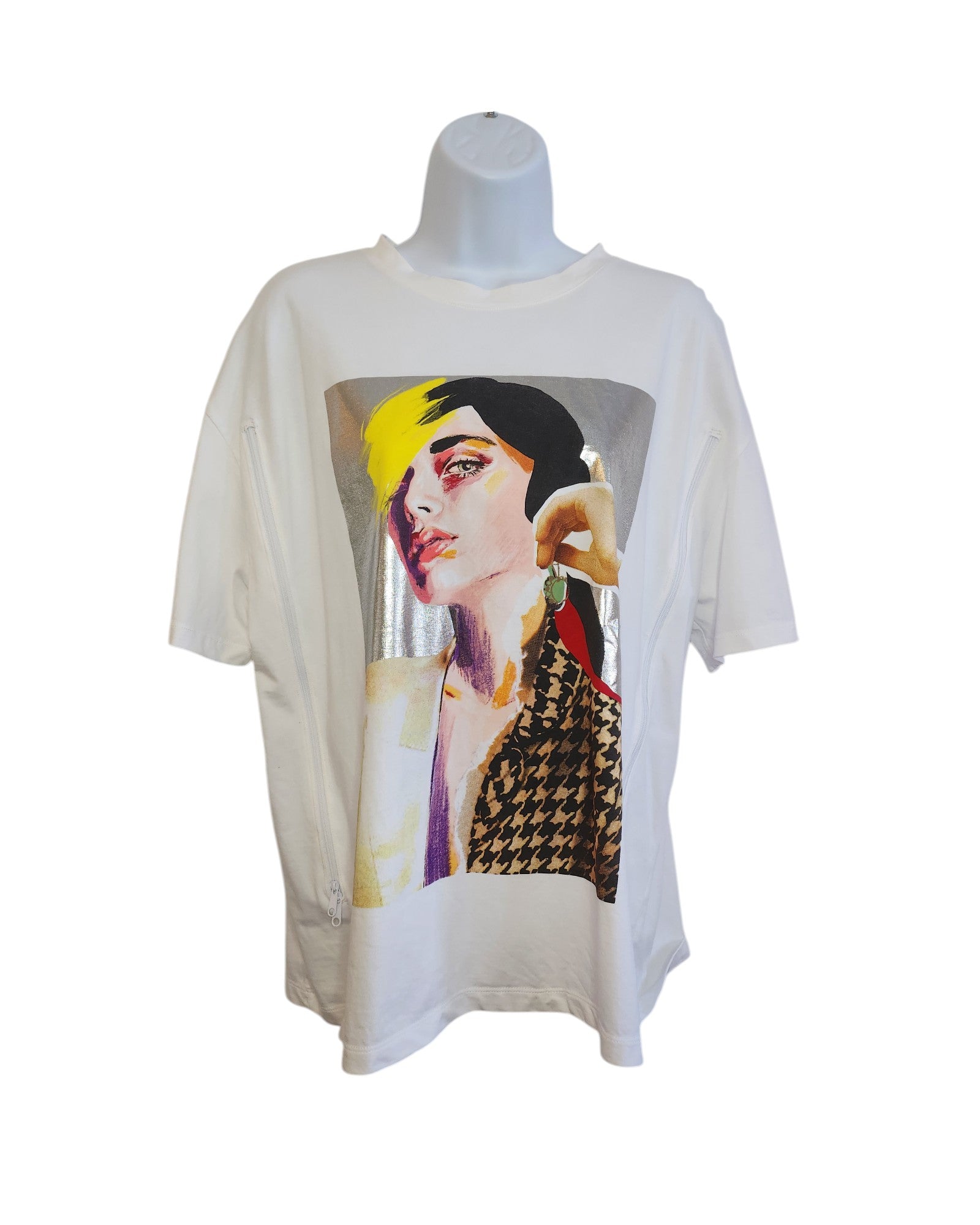 Displayed on a mannequin, the Upcycled Breastfeeding & Pumping Silver Face T-shirt by touched out mama features a vibrant graphic of an abstract womans portrait in yellow, red, and black. This eco-friendly white tee champions sustainability with style.