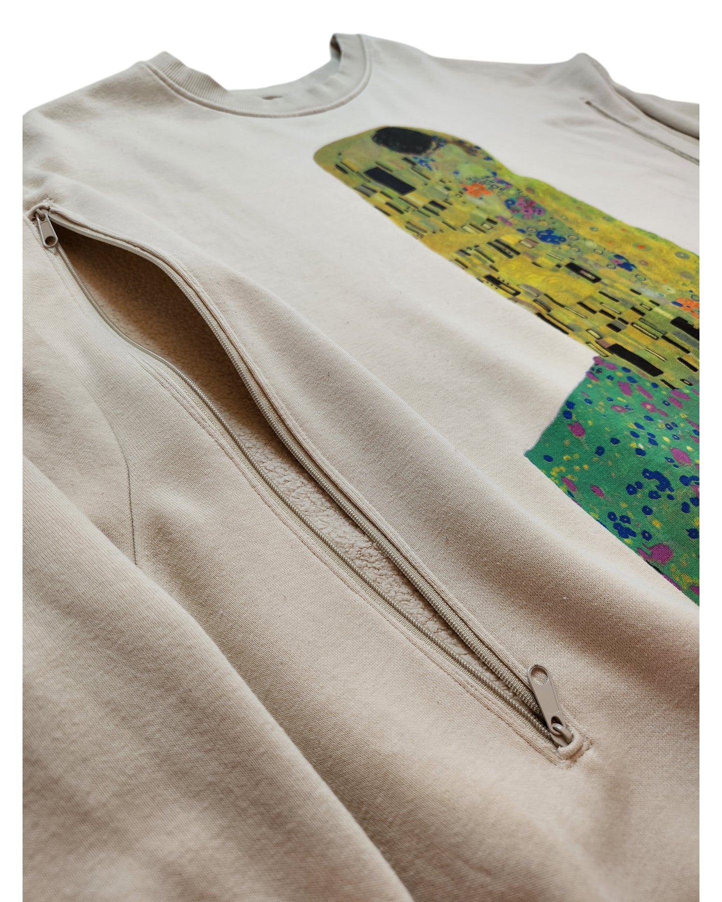 Close-up of the Upcycled Breastfeeding & Pumping The Kiss Sweatshirt XL by touched out mama, showcasing printed artwork with colorful geometric patterns and abstract shapes. A distinctive side zipper enhances its style and functionality.