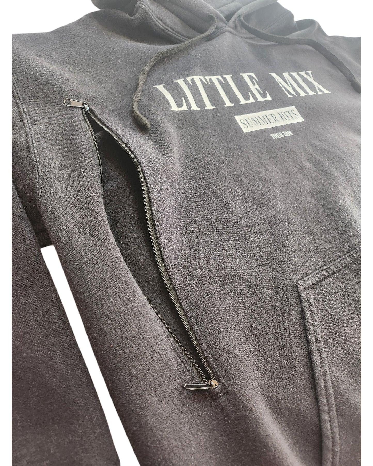 Close-up of a black Upcycled Breastfeeding (Nursing) & Pumping Little Mix Hoodie L by touched out mama, featuring LITTLE MIX SUMMER HITS 2022-2023 in white. This eco-friendly hoodie has a visible zipper on the side for added functionality and sustainable style.