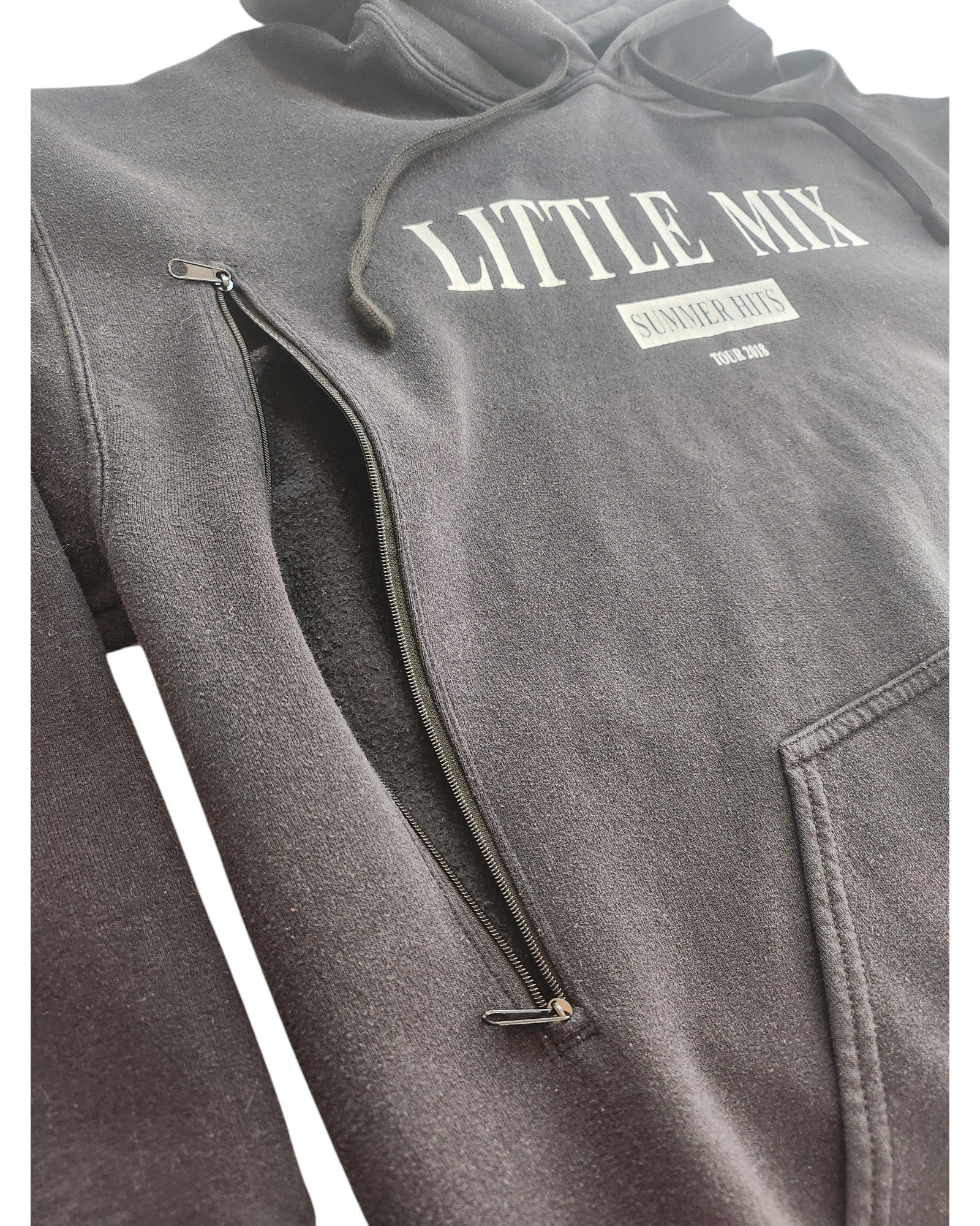 Close-up of a black Upcycled Breastfeeding (Nursing) & Pumping Little Mix Hoodie L by touched out mama, featuring LITTLE MIX SUMMER HITS 2022-2023 in white. This eco-friendly hoodie has a visible zipper on the side for added functionality and sustainable style.