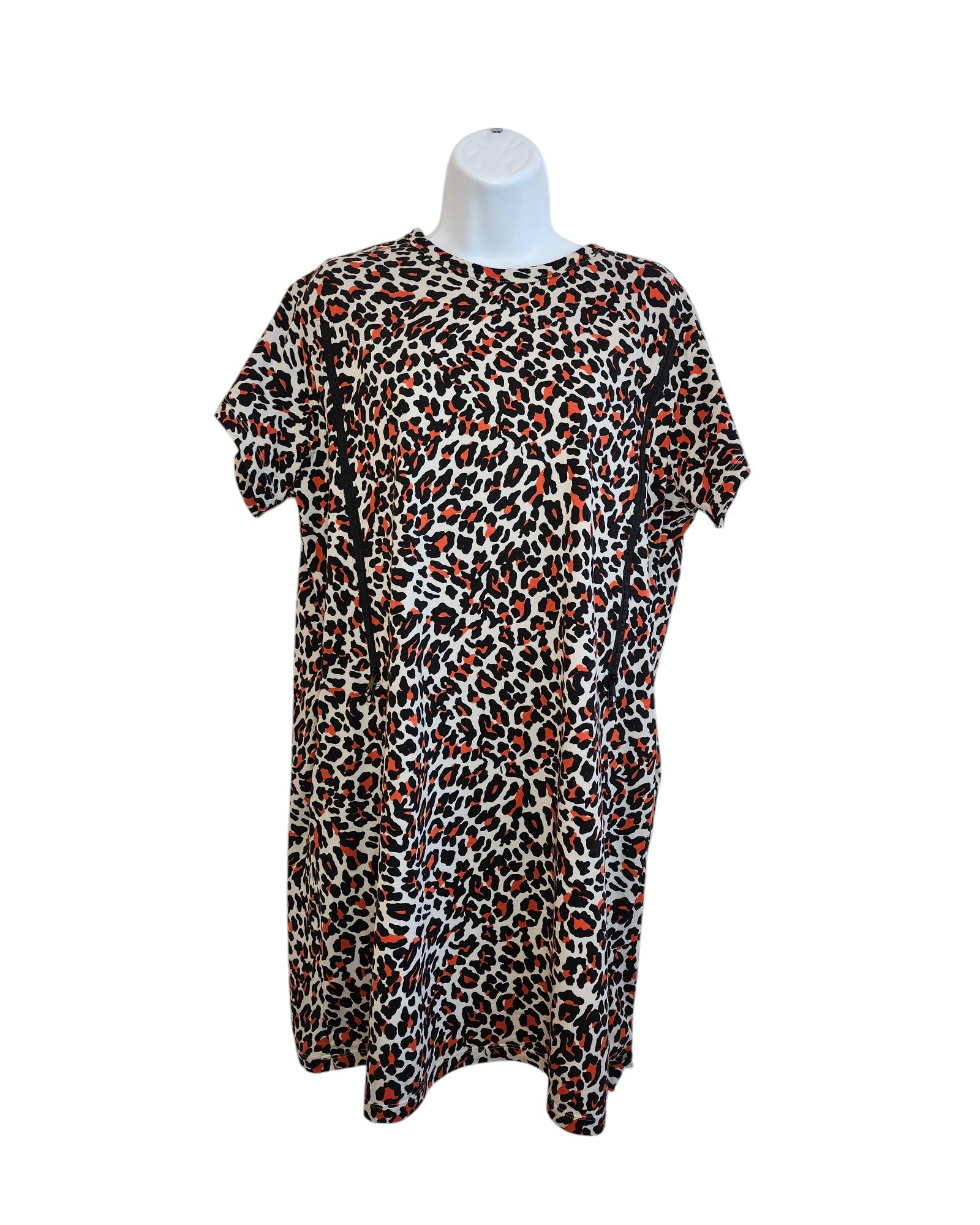 The Upcycled Breastfeeding and Pumping Leopard Pocket T-shirt Dress UK14 from touched out mama, featuring a red, black, and white leopard print on a mannequin torso, offers an eco-friendly knee-length relaxed fit combining style with sustainability.