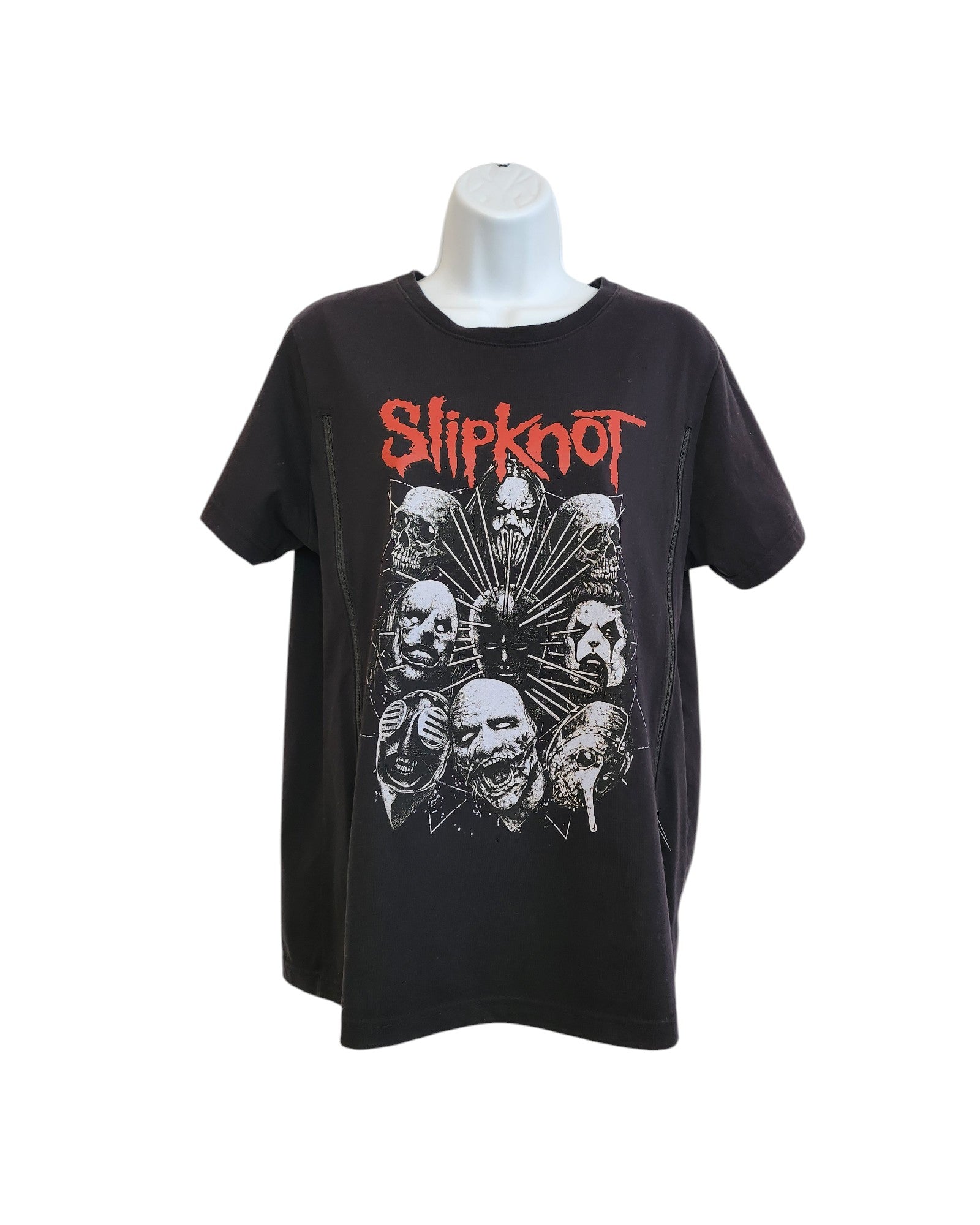 This upcycled large Slipknot T-shirt by touched out mama, displaying the bands masked faces in a circle and Slipknot in red text, offers edgy style with sustainable fashion. Modeled on a mannequin against a white backdrop, its an eco-friendly choice for breastfeeding fans.