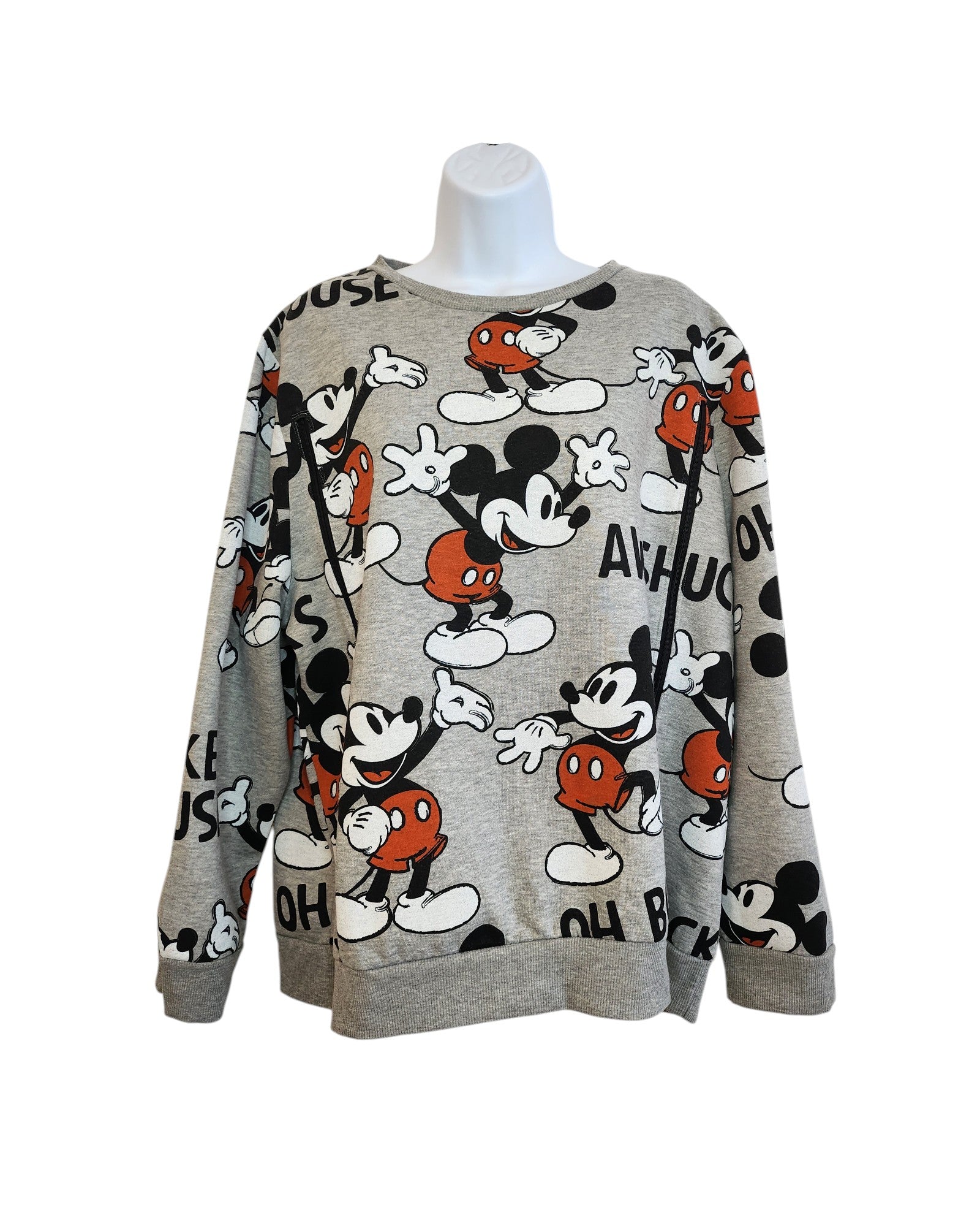 The Upcycled Breastfeeding Mickey Mouse Disney Sweatshirt by touched out mama in XL features playful vintage cartoon poses and lettering in red, white, and black. Its an eco-friendly fashion piece displayed on a headless mannequin.
