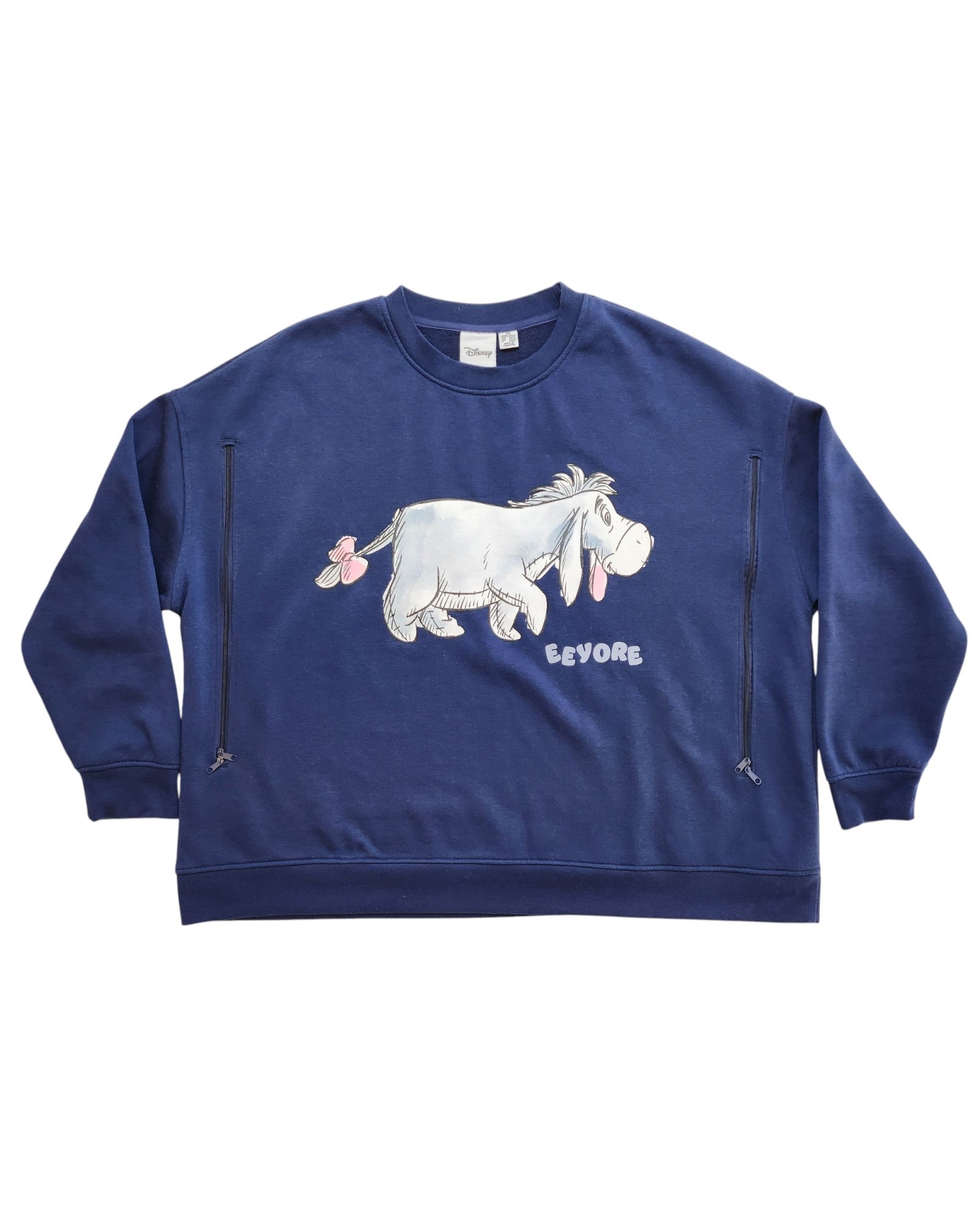 The Primark Upcycled Breastfeeding & Pumping Eeyore Disney Sweatshirt (2XL) features a graphic of Eeyore with his name printed below—an eco-friendly, cozy choice for nursing moms and Disney fans.