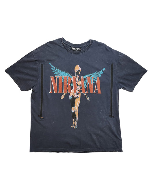 The touched out mama Upcycled Breastfeeding & Pumping Nirvana Oversized T-shirt in black features Nirvana in large red letters and an anatomical angel. Made from eco-friendly, upcycled materials, it showcases subtle distressed details.