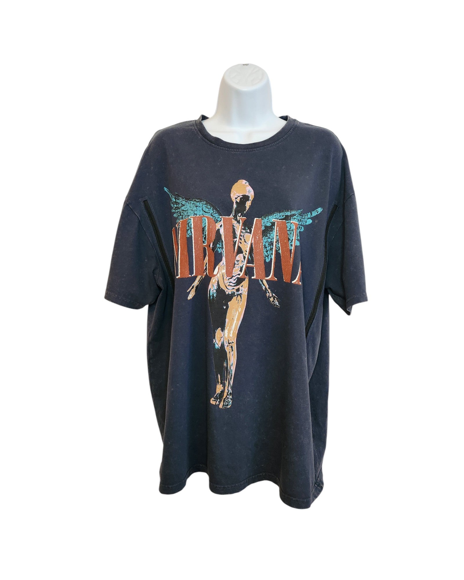 The Upcycled Breastfeeding & Pumping Nirvana Oversized T-shirt by touched out mama features a black design with NIRVANA in orange and a winged figure. Its eco-friendly and displayed on a white mannequin torso against a white backdrop.