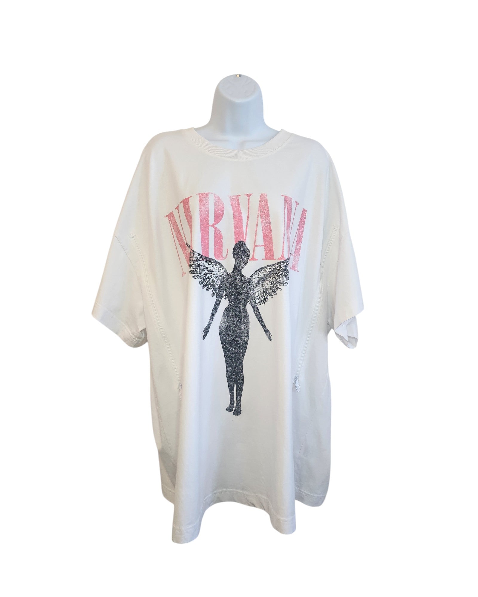 The Upcycled Breastfeeding & Pumping White Nirvana T-shirt, part of the touched out mama eco-friendly line, is showcased on a mannequin featuring Nirvana in pink above a black angel silhouette with wings.