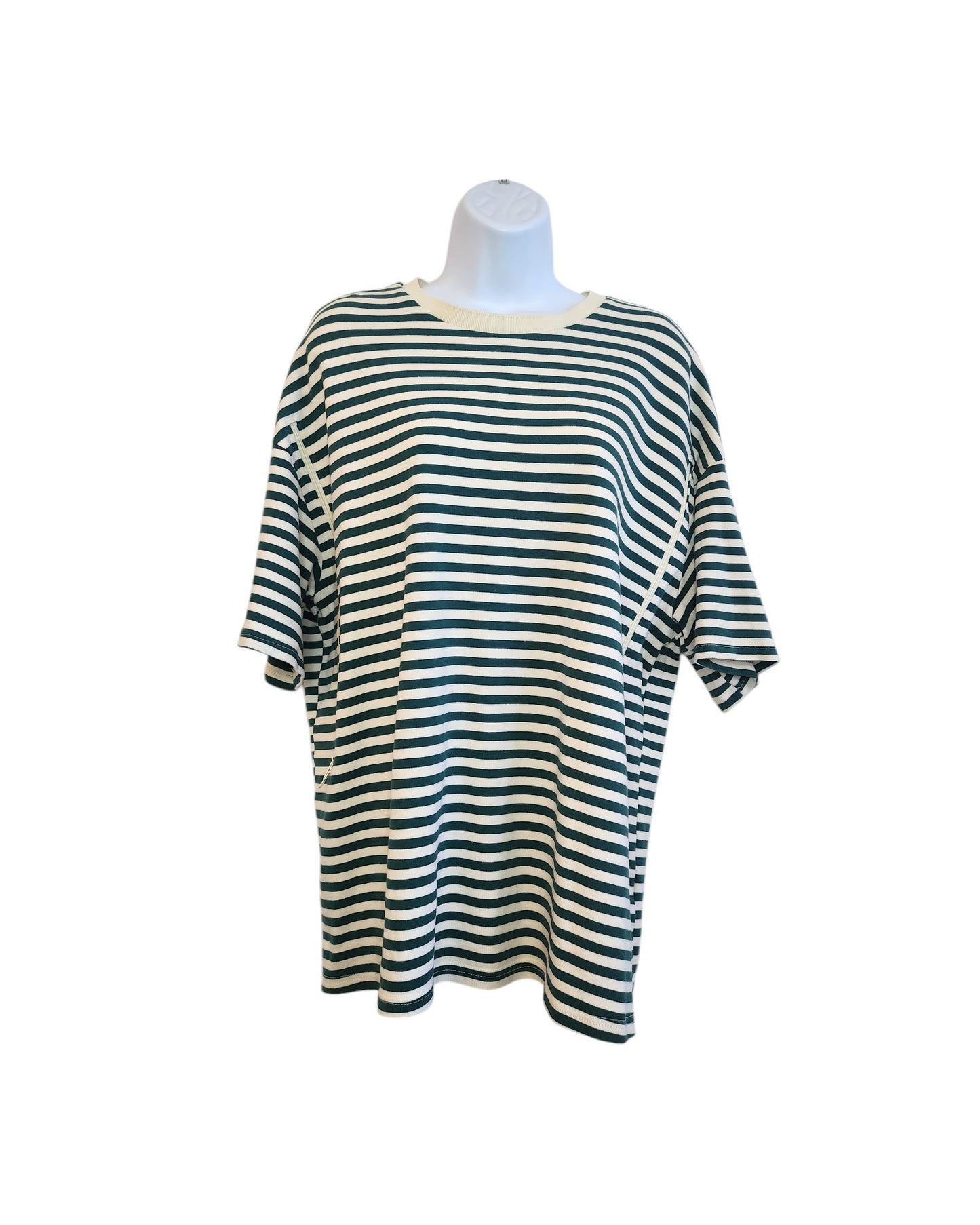 The mannequin wears a touched out mamas Upcycled Breastfeeding & Pumping Green Stripe T-shirt, XL. This casual, oversized piece features horizontal stripes and a white round neckline, highlighting sustainable fashion through its upcycled design.