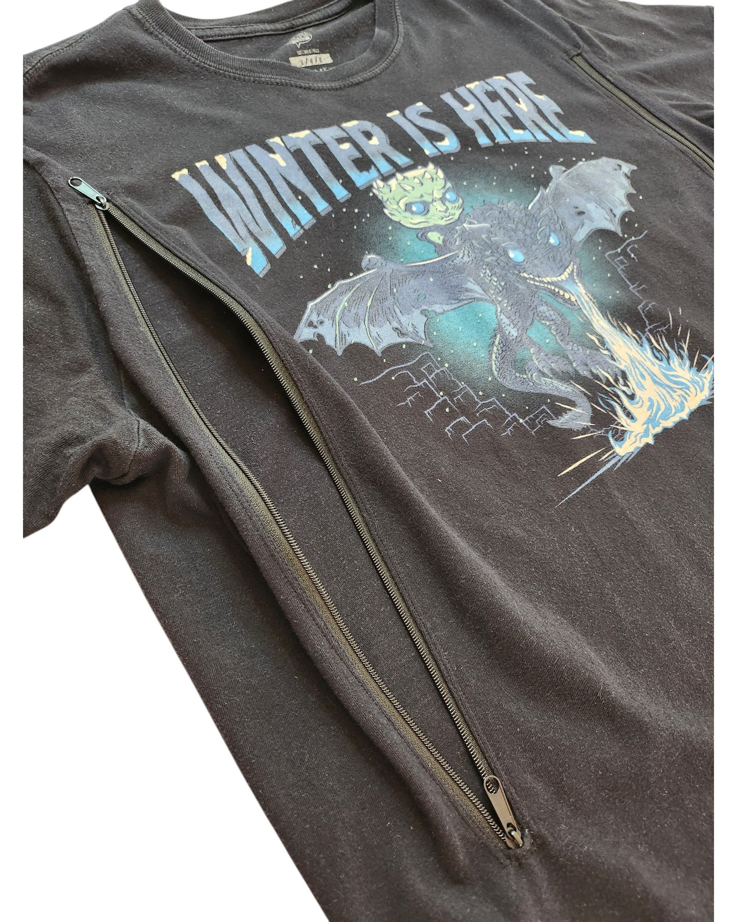The touched out mama Upcycled Breastfeeding & Pumping Game of Thrones t-shirt (L) is black with a Winter Is Here dragon graphic and icy blue details, plus two diagonal zippers from neckline to armpit for easy nursing access.