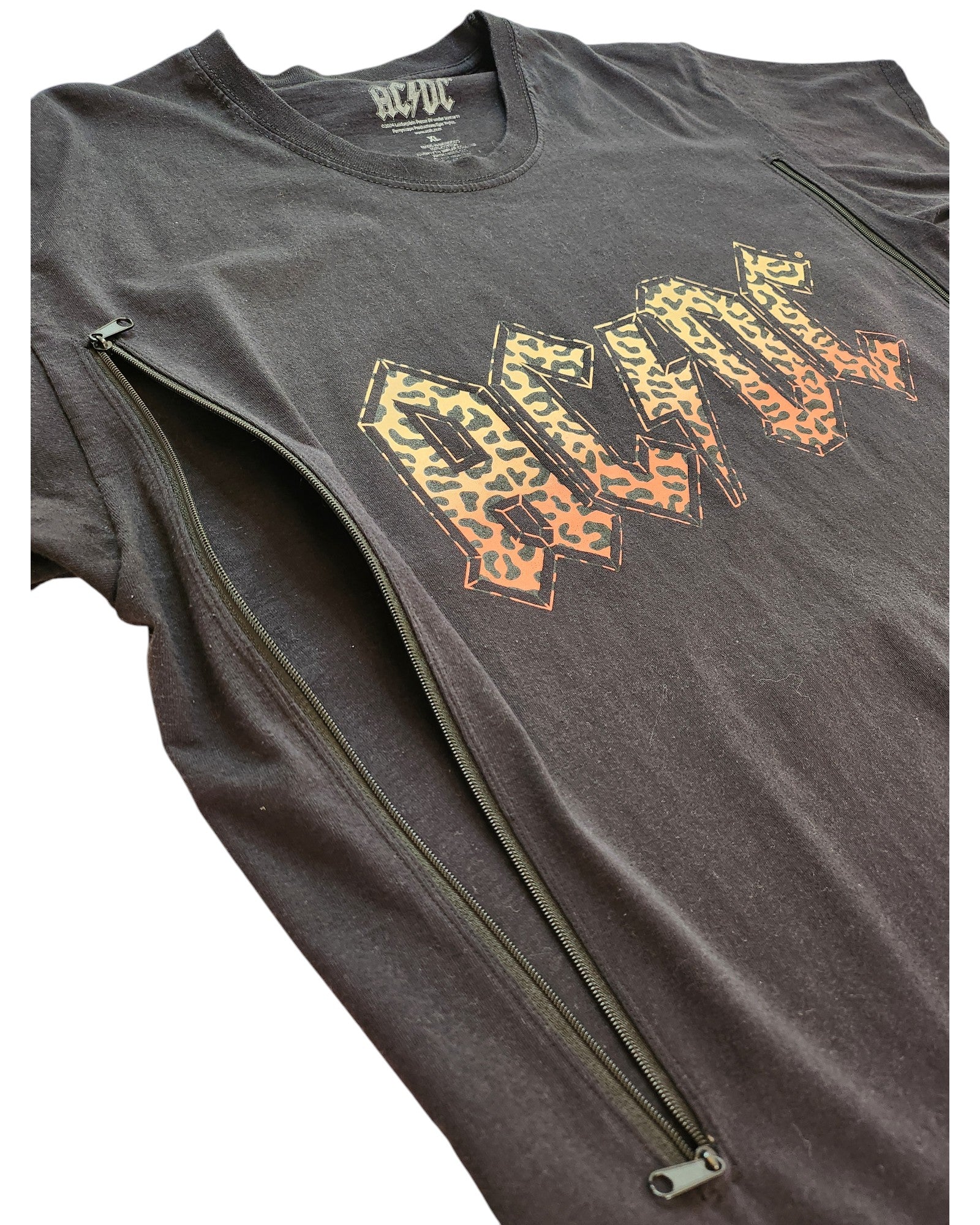 The Upcycled Breastfeeding (Nursing) & Pumping Leopard AC DC t-shirt XL by touched out mama is a trendy black tee with leopard print AC/DC letters and zippers from underarms to the bottom for stylish convenience.