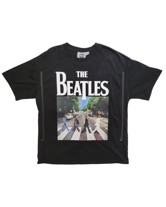 The eco-friendly touched out mama Upcycled Breastfeeding & Pumping The Beatles T-shirt (M) showcases a black design with white text above the classic Abbey Road image of four figures on a crosswalk.