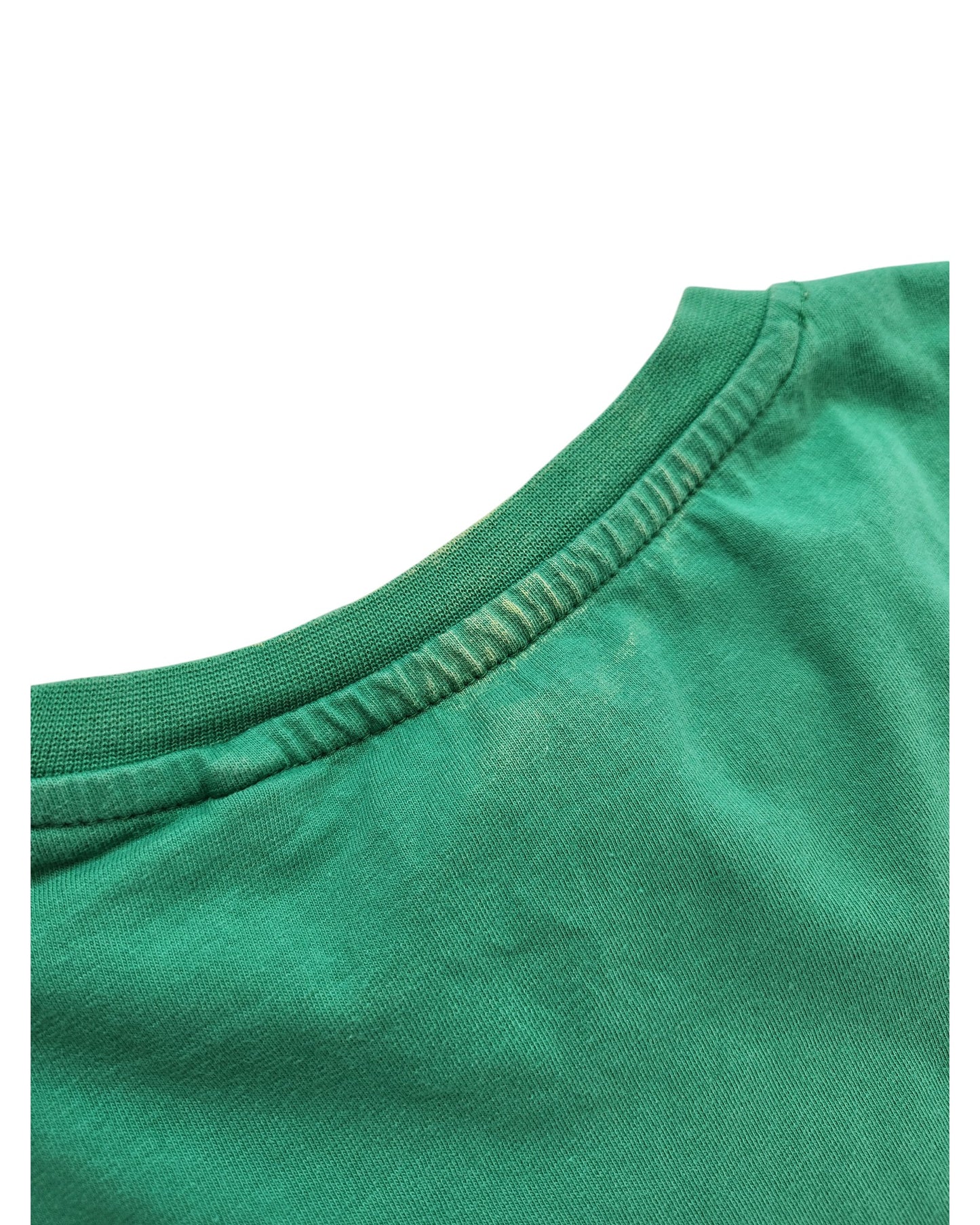 Close-up of the neckline on a touched out mama Upcycled Breastfeeding & Pumping Peanuts Snoopy T-shirt in green, showcasing visible stitching and slight discoloration where a tag might have been, with the upcycled fabric appearing soft and gently worn.