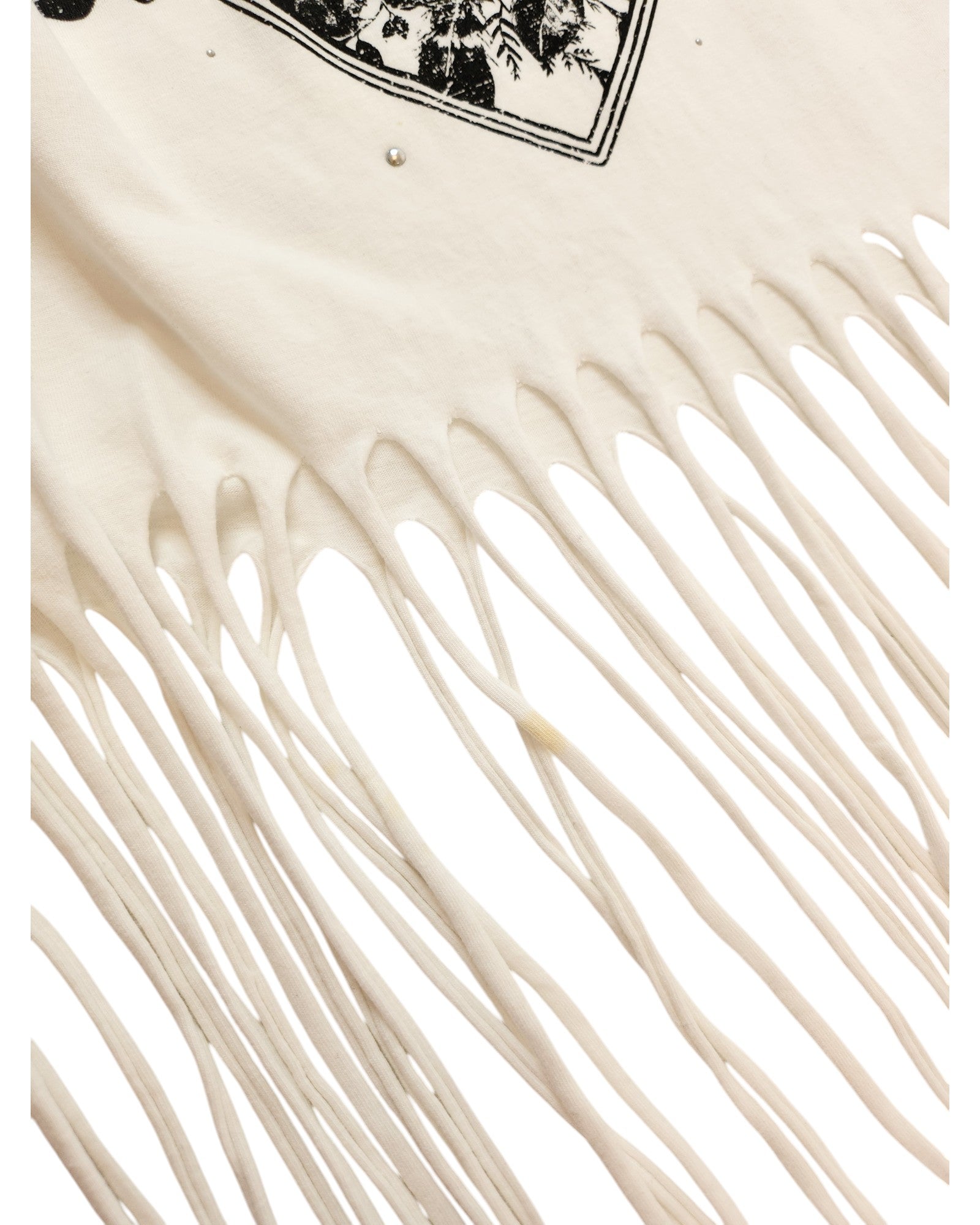 A close-up of the Upcycled Breastfeeding & Pumping Festival Fringing T-shirt M by touched out mama, crafted from preloved nursing wear. This eco-friendly garment features a detailed long fringe design and a partial printed pattern at its top edge.