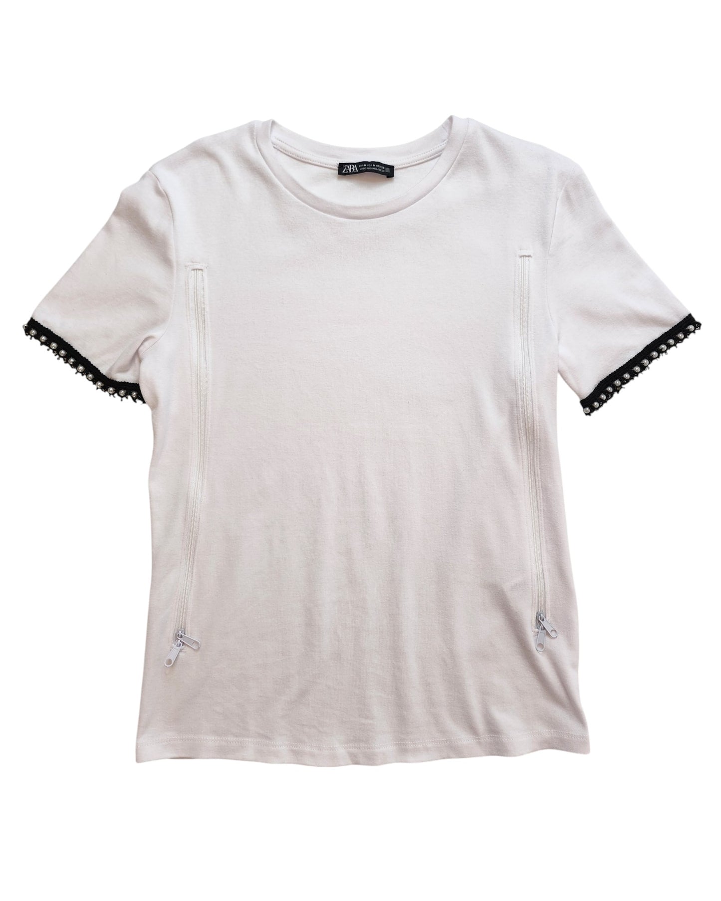 Laid flat on a white background, the upcycled Upcycled Breastfeeding (Nursing) & Pumping Plain White ZARA T-shirt M by touched out mama features short sleeves with decorative side zippers and black lace cuffs.