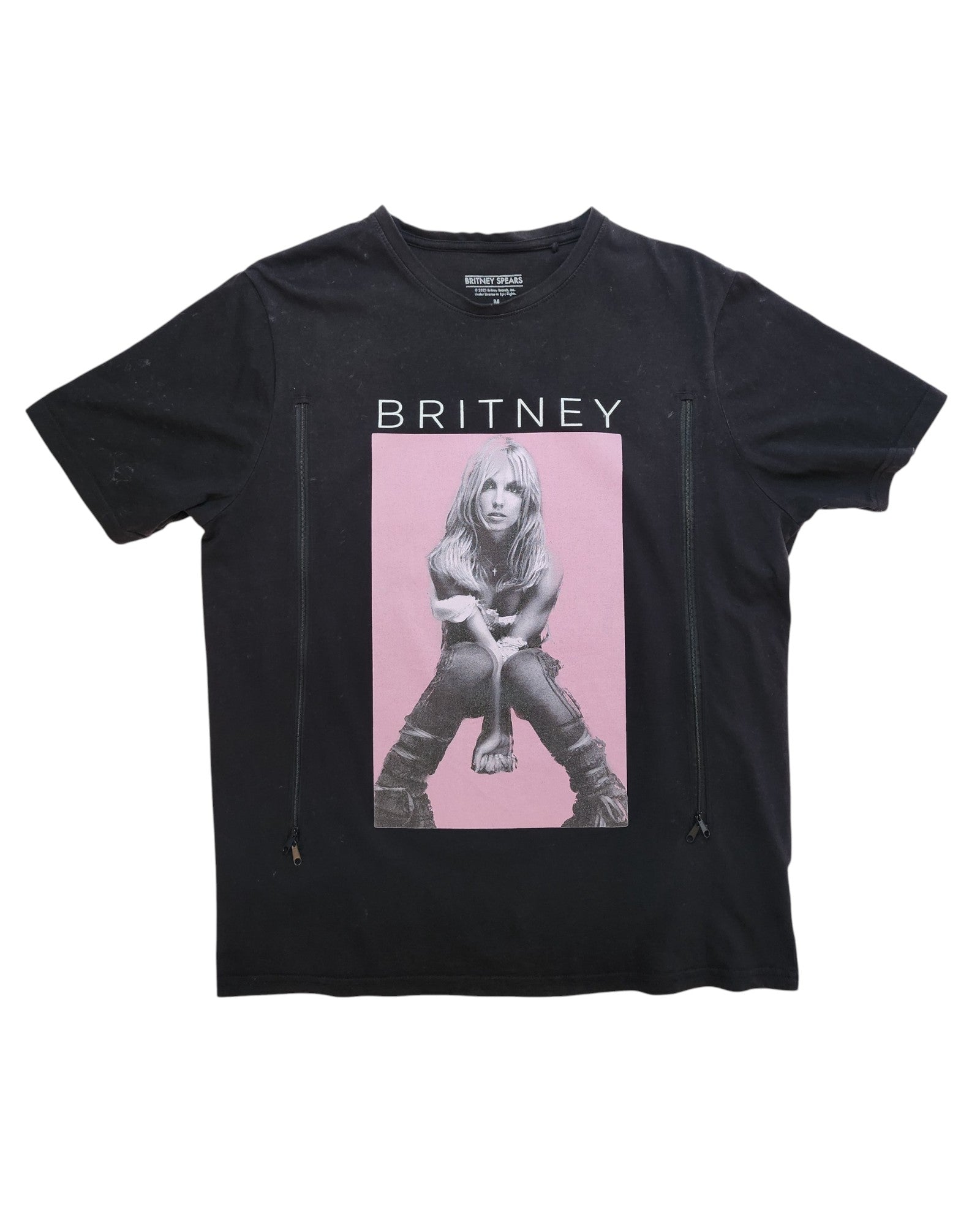 This preloved black Upcycled Breastfeeding & Pumping Britney T-shirt by touched out mama features a striking photo of a person sitting with hands on knees, highlighted by a pink rectangle and bold BRITNEY text, making it stylish and sustainably fashionable.
