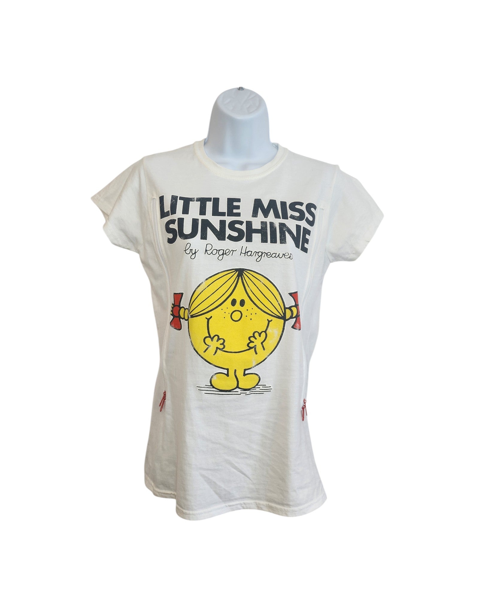 A white upcycled Truffle Shuffle t-shirt (size M) for breastfeeding and pumping features Little Miss Sunshine with yellow skin, blonde pigtails, and red bows—an adorable preloved piece inspired by Roger Hargreaves.