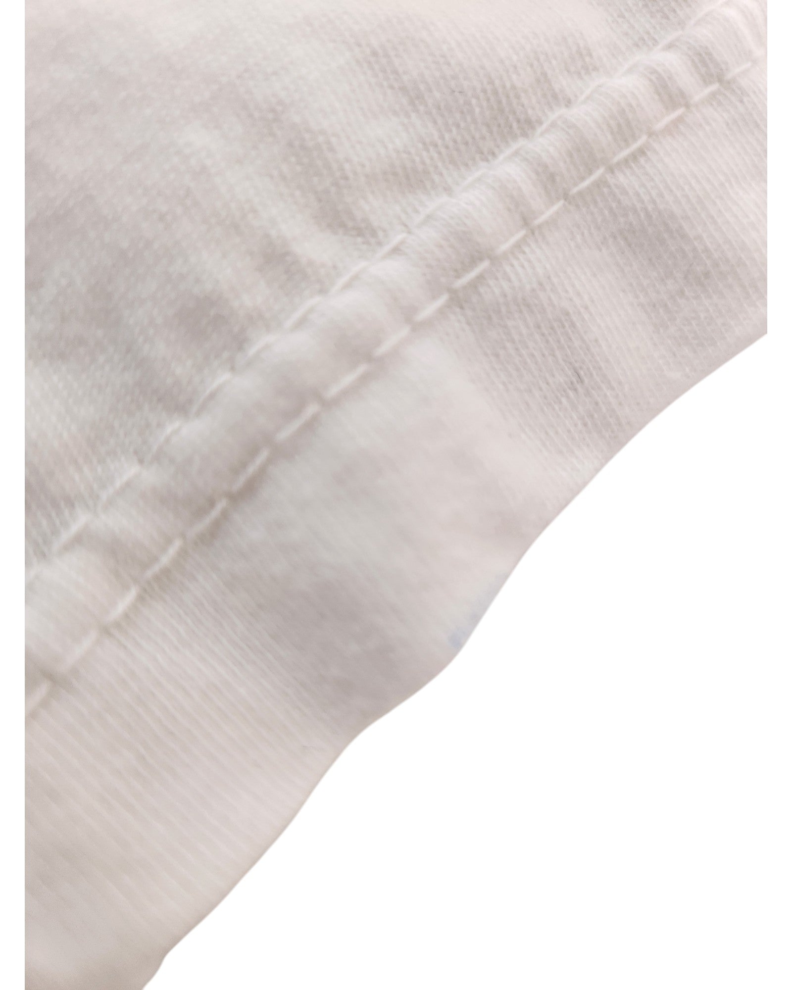Close-up of a white Upcycled Breastfeeding & Pumping Times Square t-shirt by Sun Wear, size L, shows visible stitching and a diagonal seam, highlighting quality craftsmanship typical of upcycled apparel.