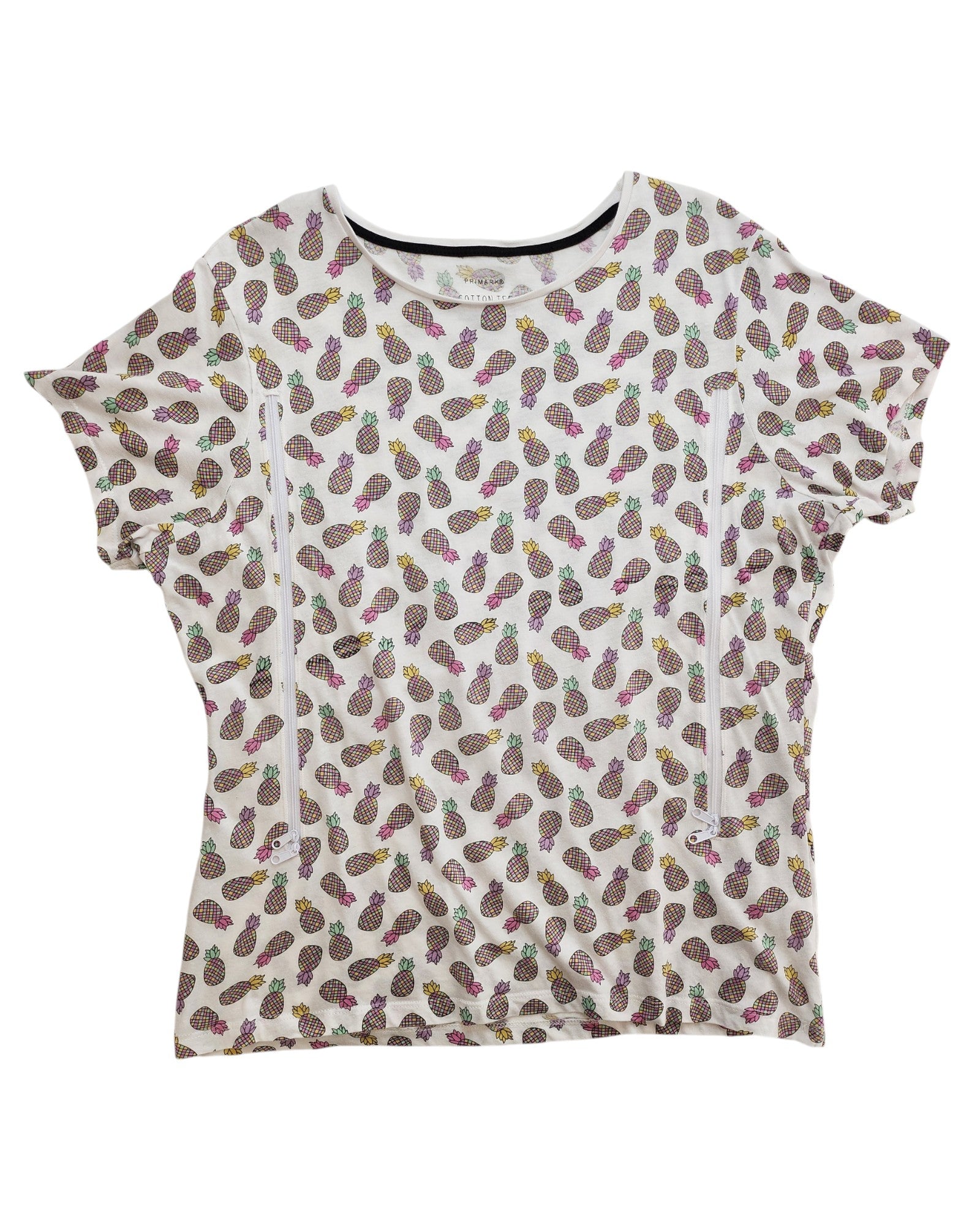 The Primark Upcycled Breastfeeding (Nursing) & Pumping Pineapple t-shirt UK20 is a white, short-sleeve eco-friendly top with colorful pineapples—crafted from preloved clothing for sustainable style.