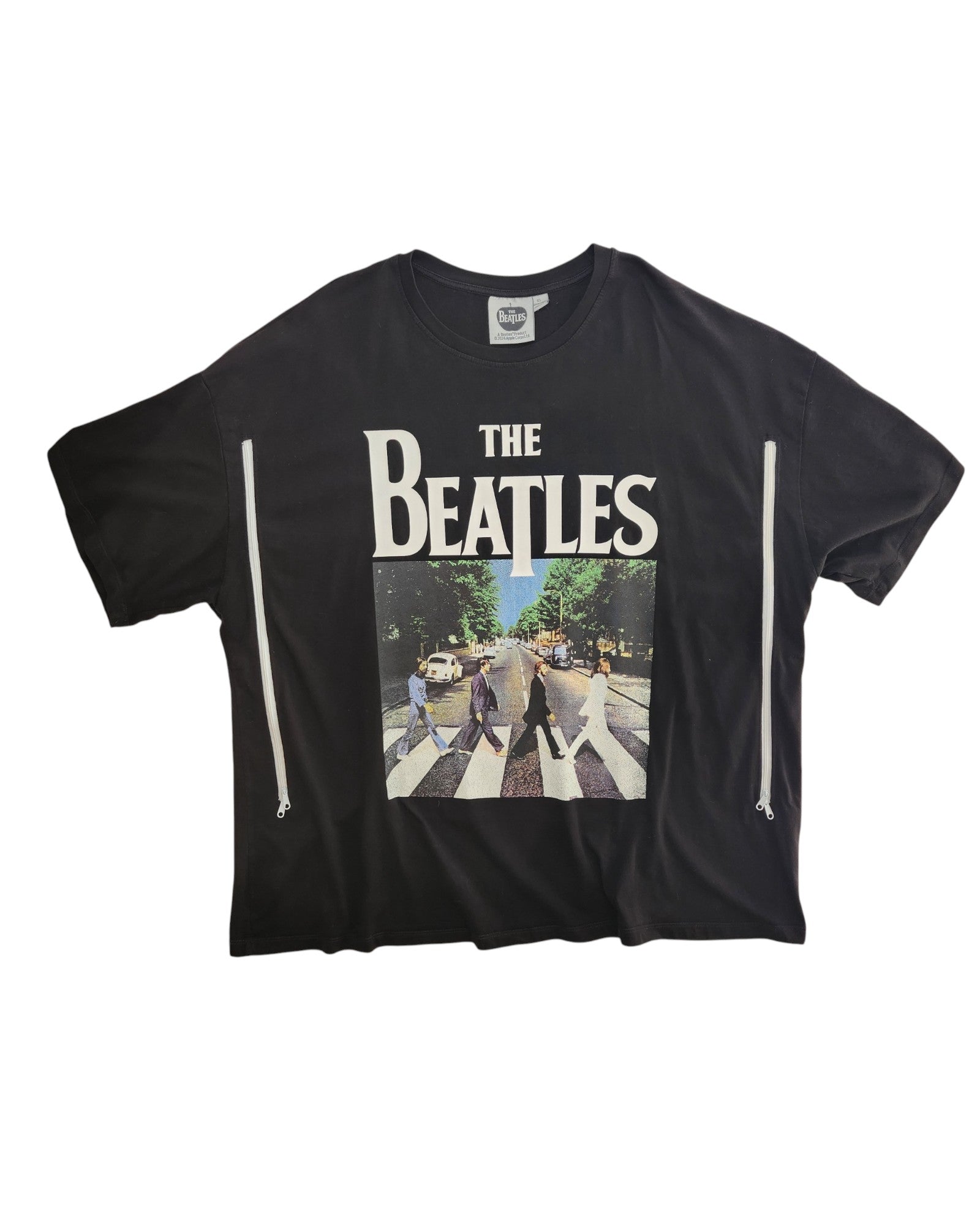 An XL upcycled black The Beatles t-shirt, designed for breastfeeding and pumping, features bold white band lettering above the Abbey Road album cover—blending sustainable style with nursing convenience.
